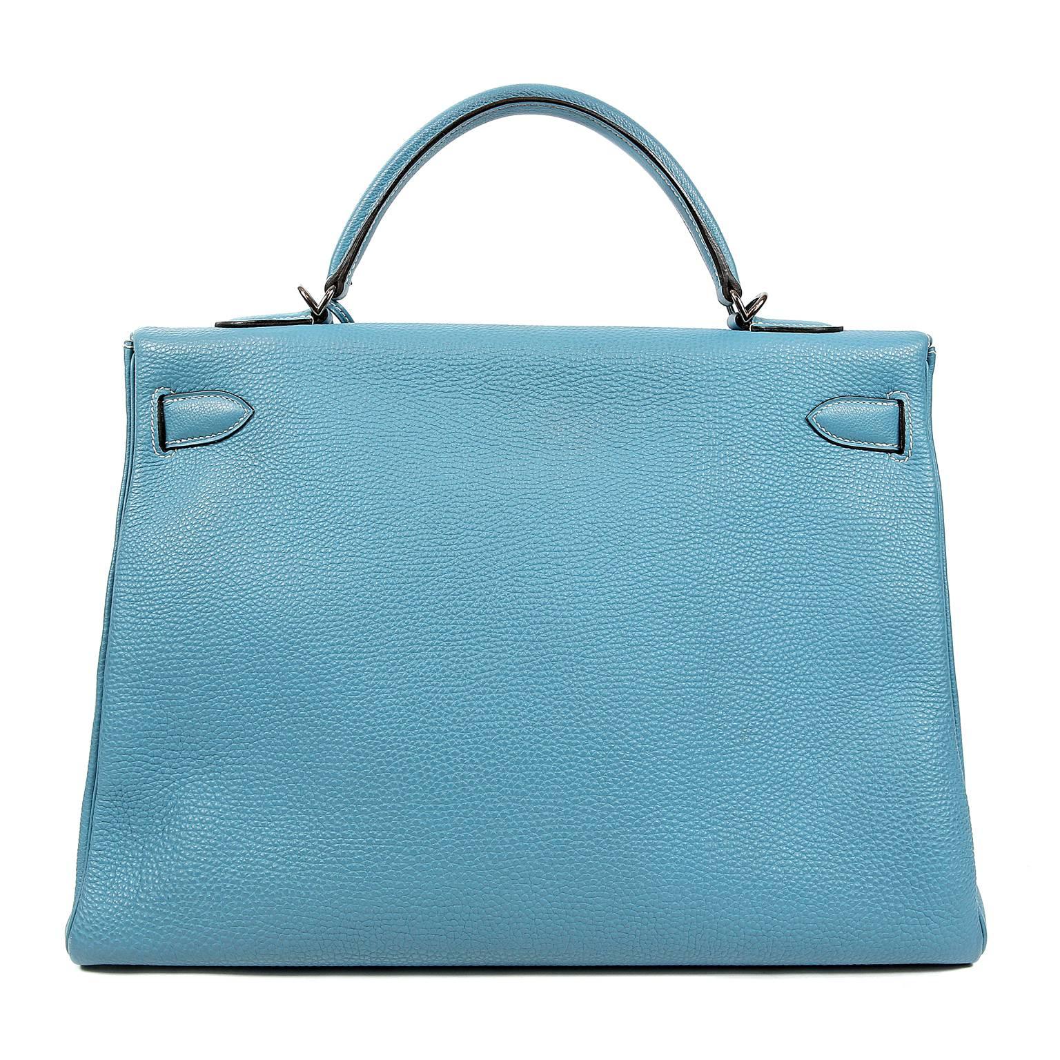 This authentic Hermès Blue Jean Togo 40 cm Kelly Bag is in excellent plus overall condition.    Hermès bags are considered the ultimate luxury item worldwide.  Each piece is handcrafted with waitlists that can exceed a year or more.  The Kelly is