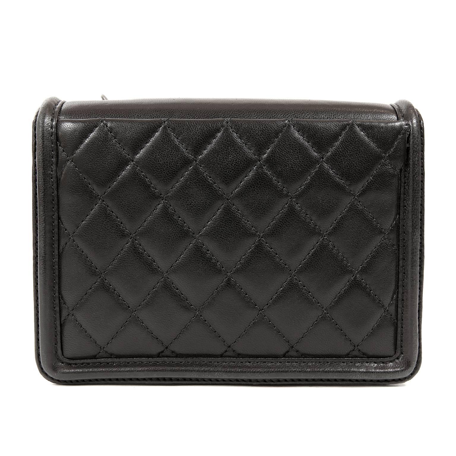 Chanel Boy Brick Flap Bag in Black- Pristine condition
  From the 2013 collection, the edgy Brick is the perfect companion for evening or daytime hands-free wear.
Black structured lather small flap bag has ruthenium interlocking CC adorning the