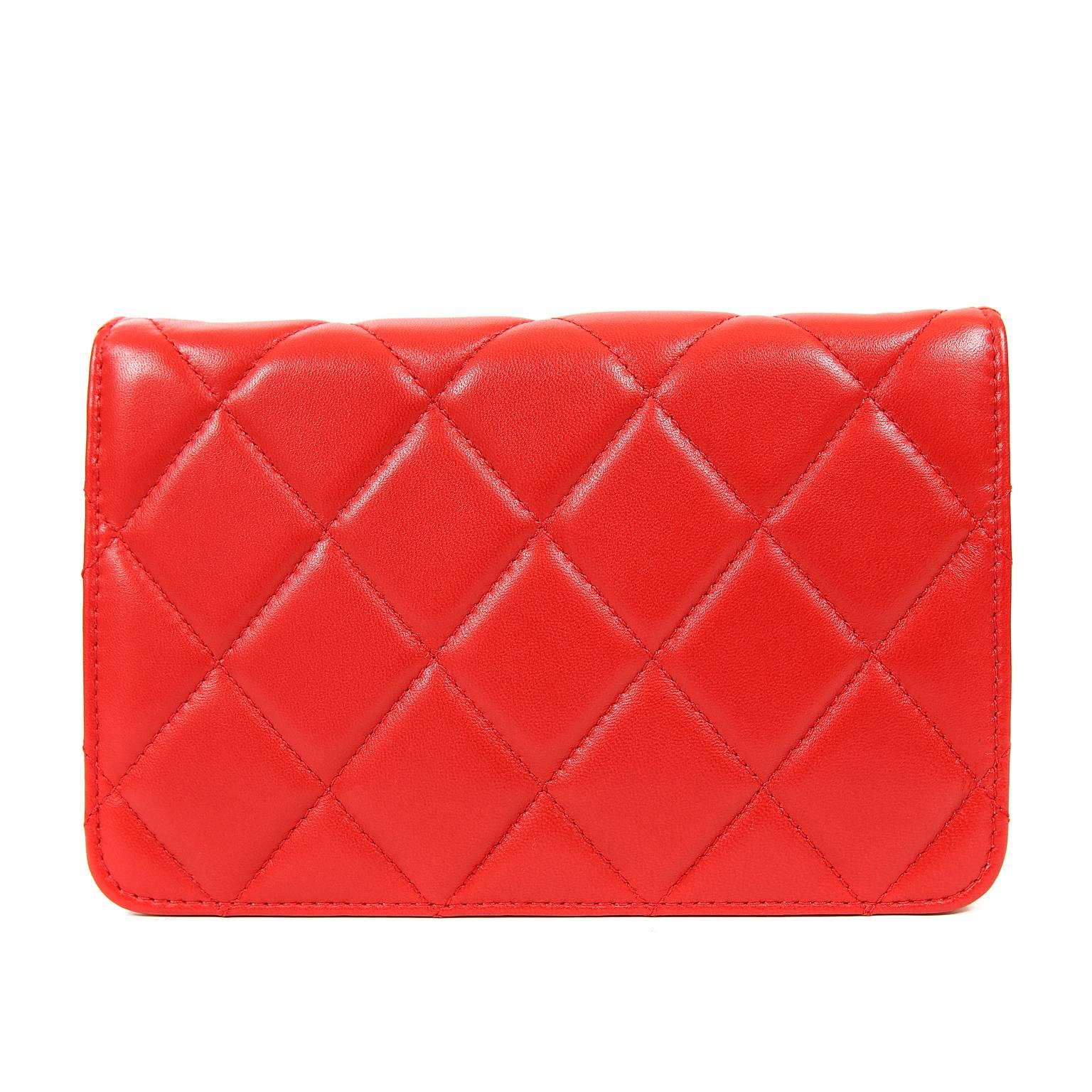 Chanel Red Lambskin WOC- PRISTINE; Never Carried
   Vivid and cheerful, this Wallet on a Chain has a unique hinged gold tone CC closure that really demands attention.  
Lipstick red lambskin Wallet on a Chain (WOC) is quilted in signature Chanel