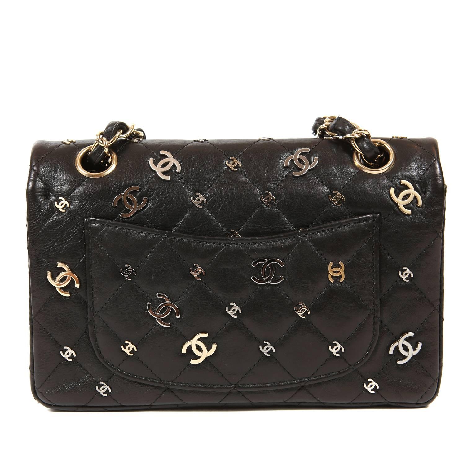 Chanel Black Calfskin CC Punk Small 2.55 Reissue Double Flap Bag- Pristine Condition
  From the 2007 collection, this unique adaptation of the reissue is covered in metal interlocking CC’s in gold, silver and gunmetal.  
Black calfskin is quilted in