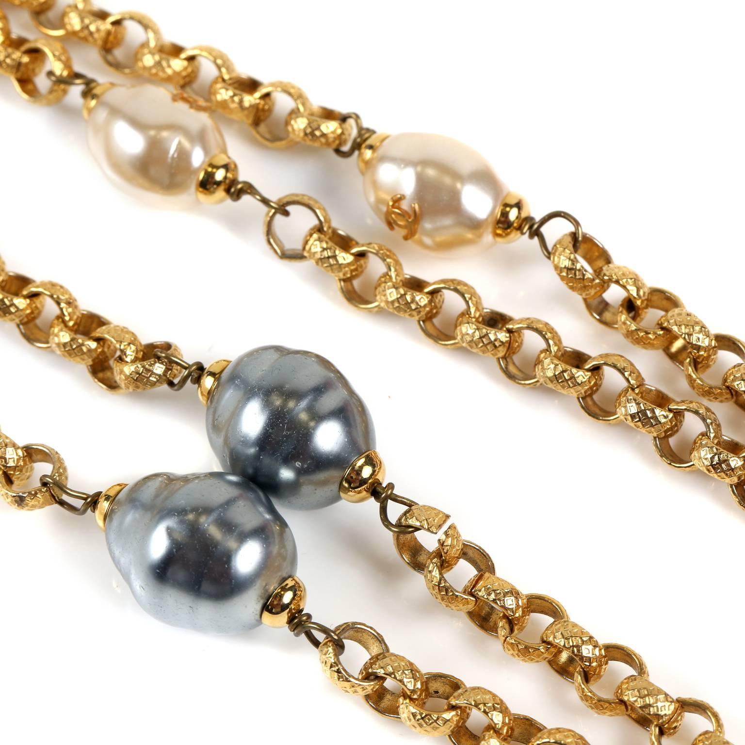 Chanel Pearl and Gold Link Necklace- PRISTINE
  A very beautiful piece that can be worn single or double layered, it is wonderful addition to any collection.
Long gold quilted link necklace with pearl stations.  White pearls have gold interlocking