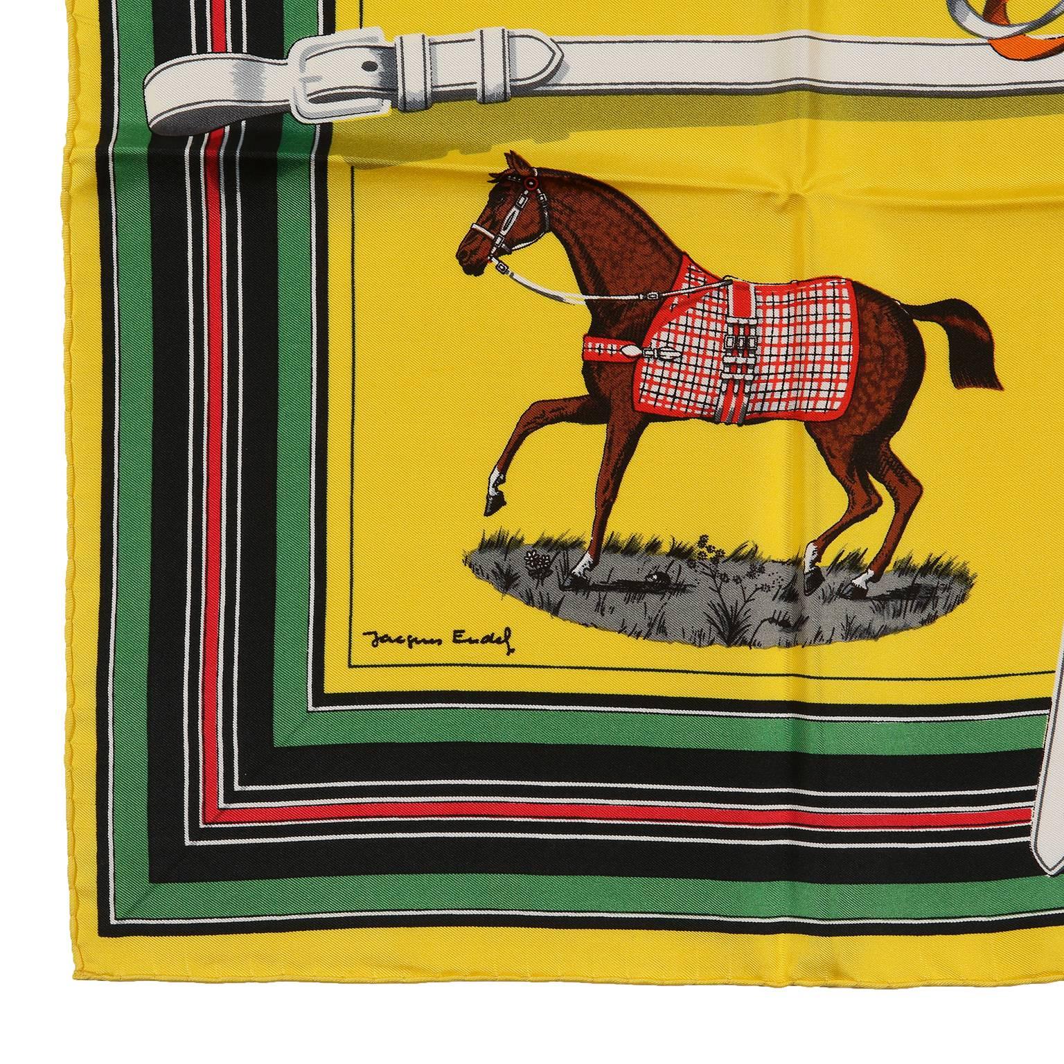  Hermès Yellow Silk Couvertures et Tenues de Jour 90 cm Scarf- PRISTINE; Never Worn
 Designed by Jacques Eudel, the equestrian theme depicts horses in their finest blankets and gear. White belts divide the print into a grid design.   100% silk.  