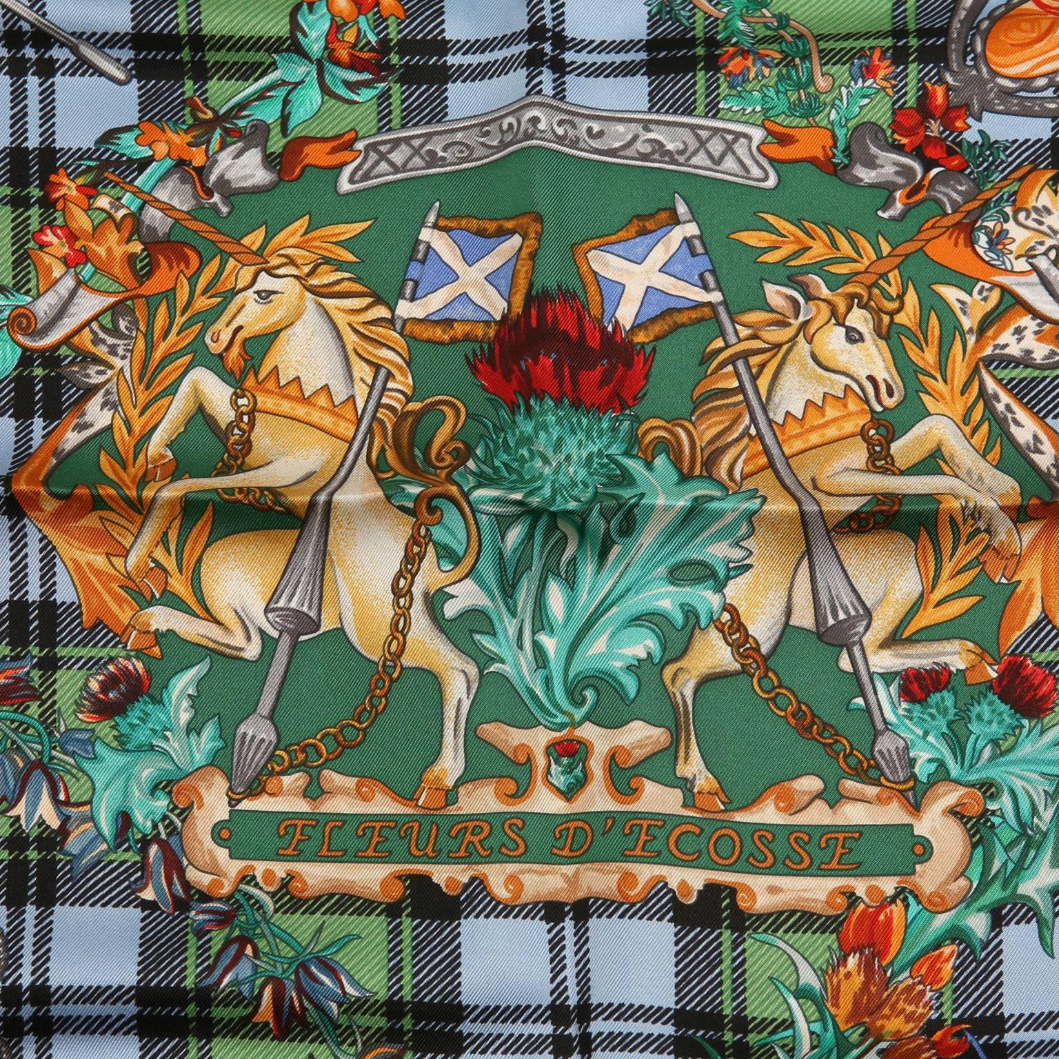 This authentic Hermès Green Fleurs D’ecosse 90cm Silk Scarf is new with the box.  Designed by Sylvia Kerr, the print features a green plaid background with crest and colorful “flowers of Scotland.”    35” square. 100% silk.    Made in France.
A203
