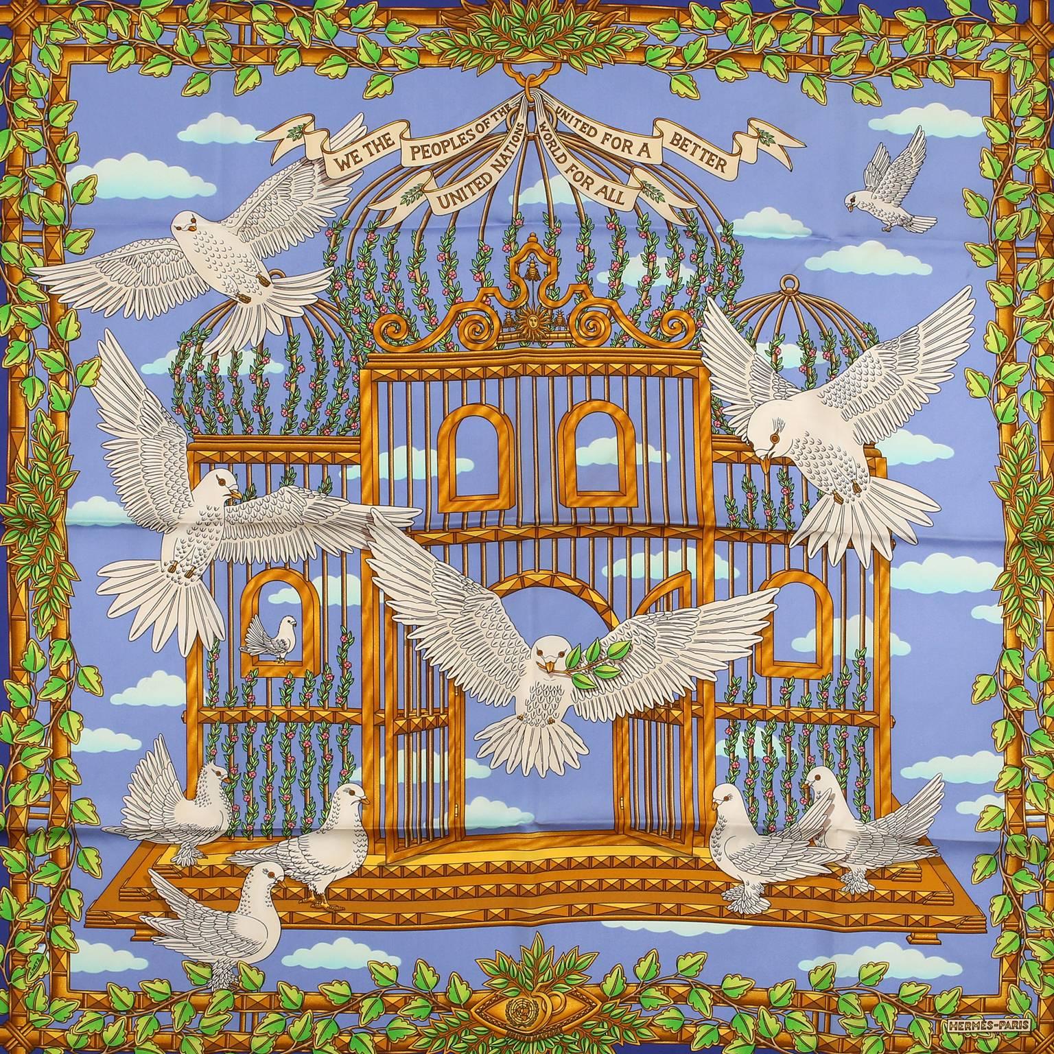 Hermès United Nations 90 cm Silk Scarf - NEW with the original box.
The print features a blue background with a dove release design, symbolizing peace.  The collectible style was created to commemorate the 50th anniversary of the United nations