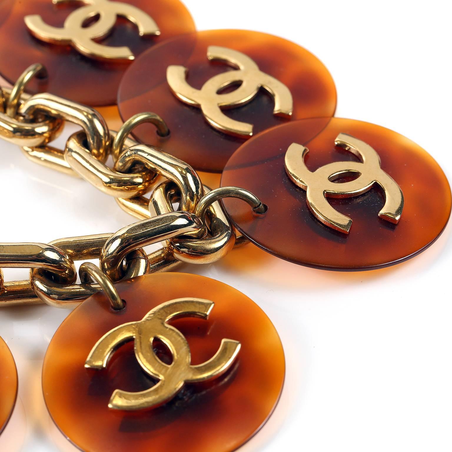 Chanel Tortoise Resin CC Disc Bracelet - Excellent
Gold oval link bracelet has resin tortoise coin discs, each with a gold interlocking CC on it.  Please note: one disc is missing the CC.  Toggle closure.
A207
