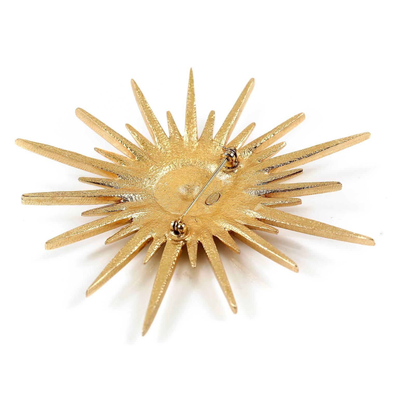 Chanel Gold Starburst Brooch- MINT condition
  A beautiful design, it enhances everything from lapels to scarves and more.
Matte gold starburst design has crystal embellishments.  Interlocking CC in the center. Rear fastener with safety catch. 