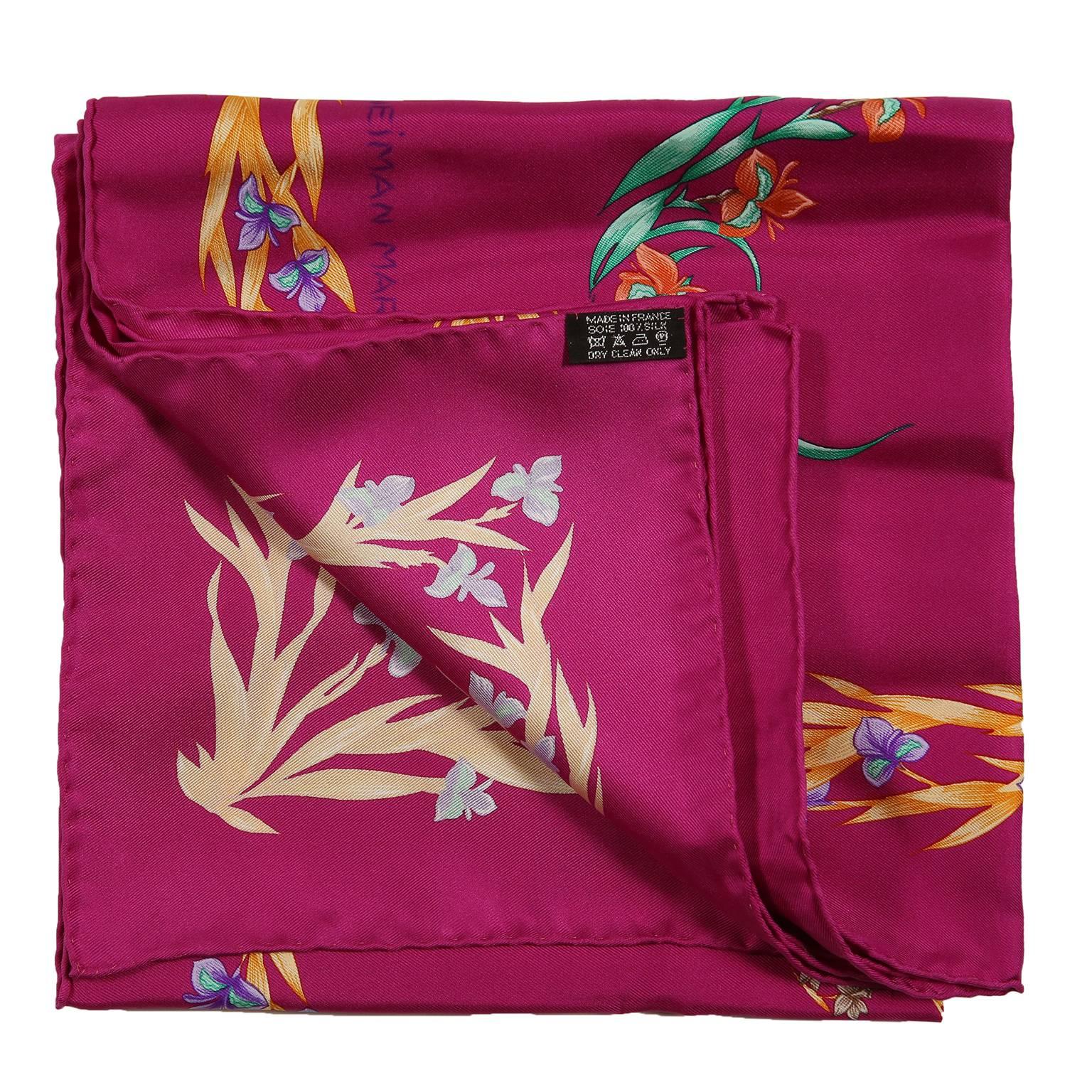 This authentic Hermès Cheval Fleuri 90 cm Silk Scarf is pristine.  A  Limited Edition reissued in 2007 to commemorate the 100th anniversary of Neiman Marcus, originally issued in 1962 and designed by Henri d’Origny. 
Fuchsia background with