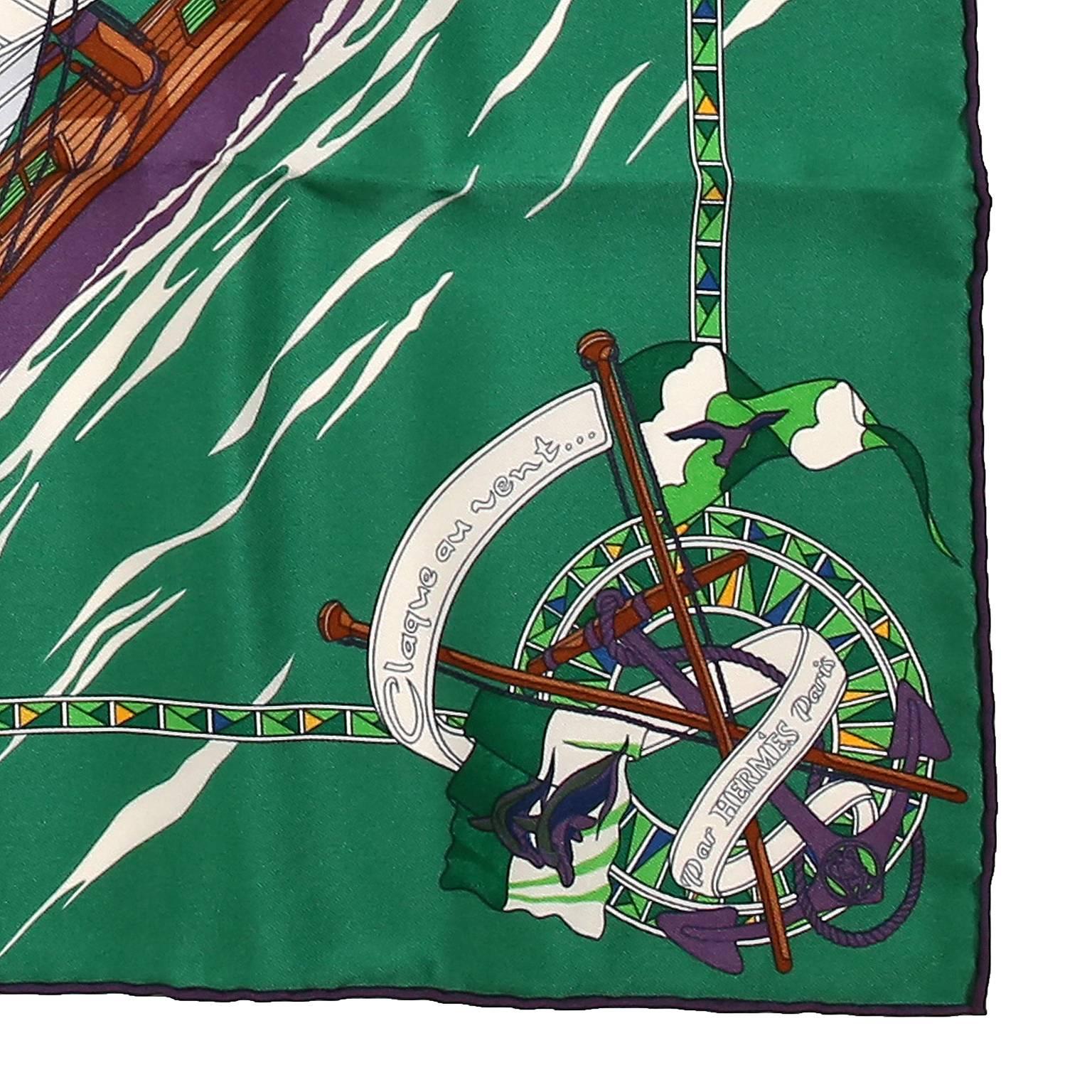 This authentic Hermès Green Claque au Vent 90 cm Silk Scarf is new.  Original issue 2011 and designed by Dominik Jarlegant.  Bright green background with sailboats and flags on the water.  “Slap in the wind” refers to the sound of a sail in a