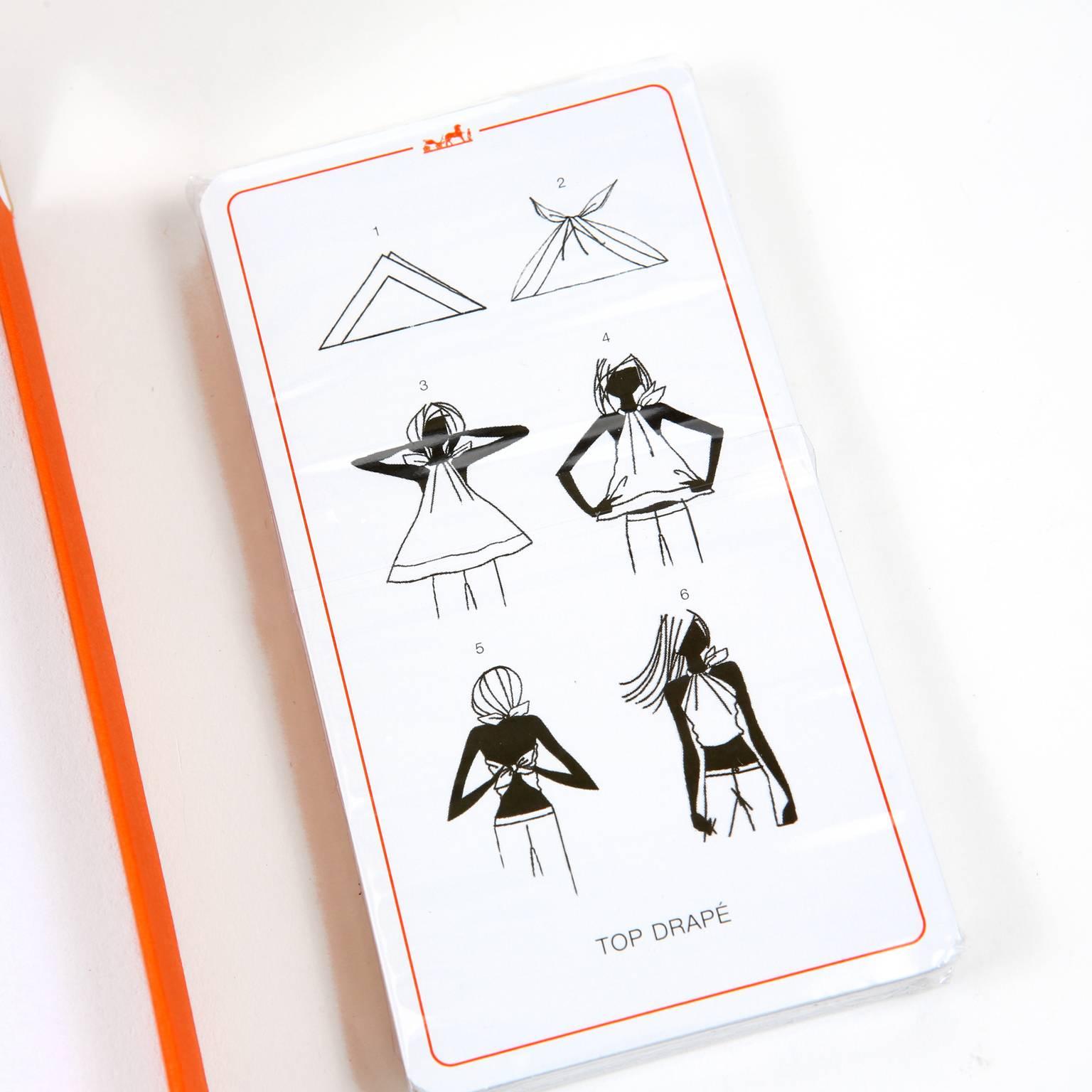 These authentic Hermès Scarf Knotting Cards are new with the box.  Illustrations with step by step directions and photos of the finished look on each card.  A perfect approach to finding new and creative ways to enjoy any scarf collection.  
A259
 
