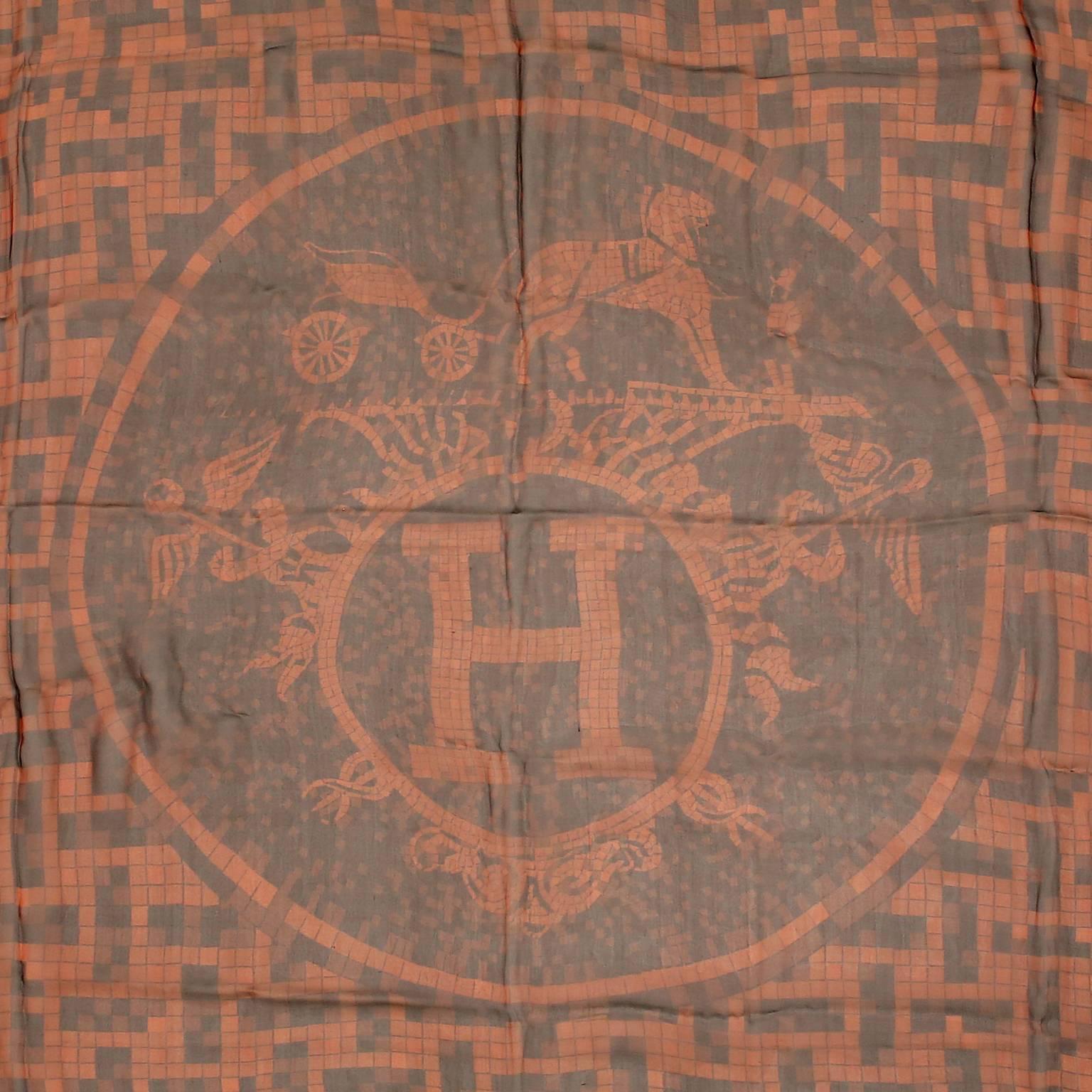 This authentic Hermès Mosaique au 24 Mousseline GM Shawl is new.    Designed by Benoit Pierre Emery originally in 2008, it was reissued as a shawl in 2011/2012.  Tiny square tiles create a mosaic of the iconic Hermès H with carriage and horse.