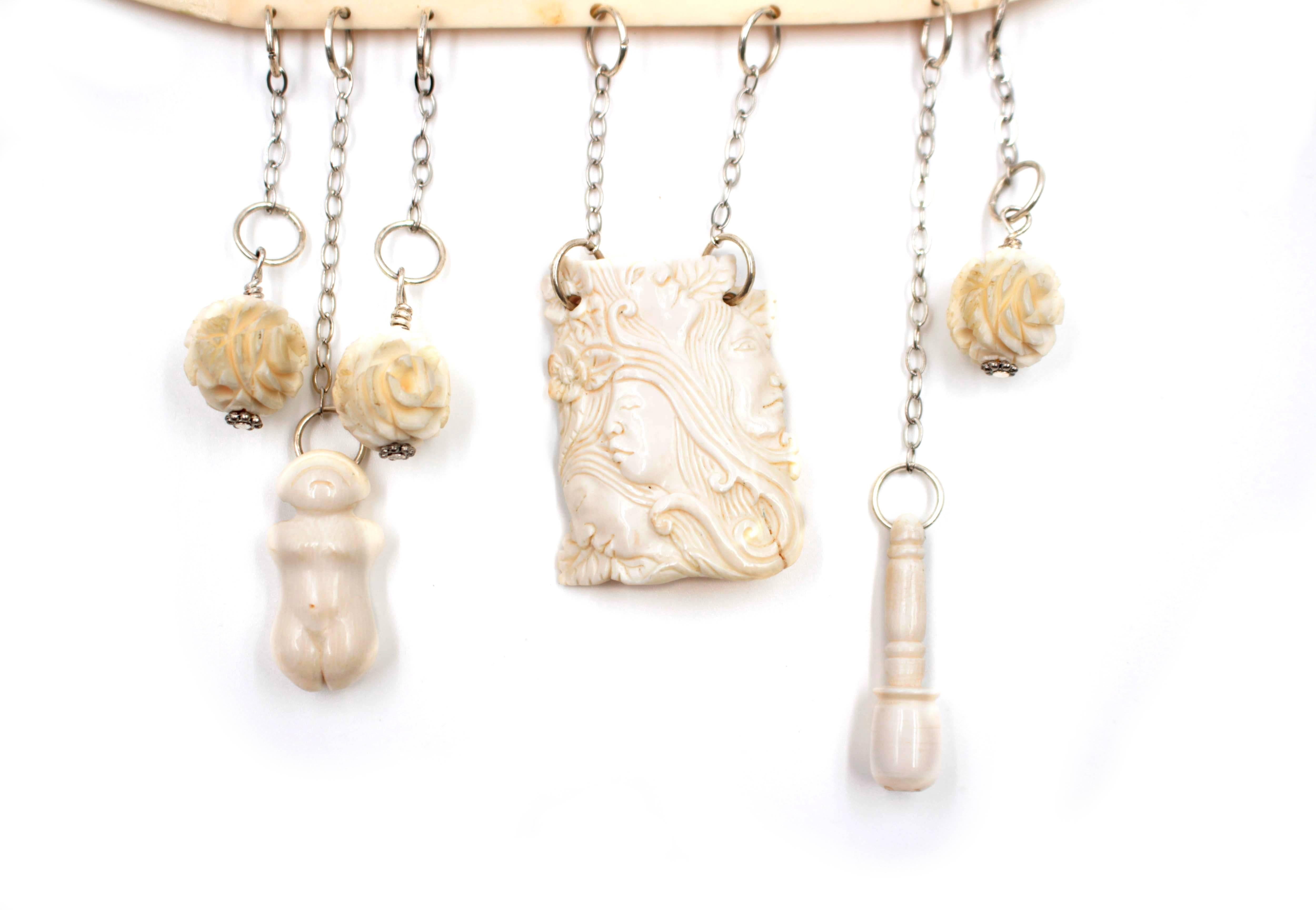 The Rabbit Necklace is a mixed media one-of-a-kind necklace with hand carved mastodon ivory details. This art jewelry necklace is a wonderful statement piece that measures 30 x 5.25 in.