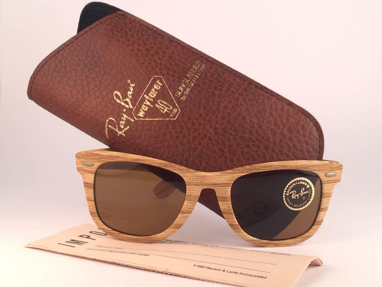 
New and Rare collectors item the ultra rare edition of the classic Wayfarer: The Woodies. 
These were made in 3 colors, from light brown to dark brown. These are the light driftwood edition. Sporting B15 grey lenses. 5022, the classic size. 
Frame