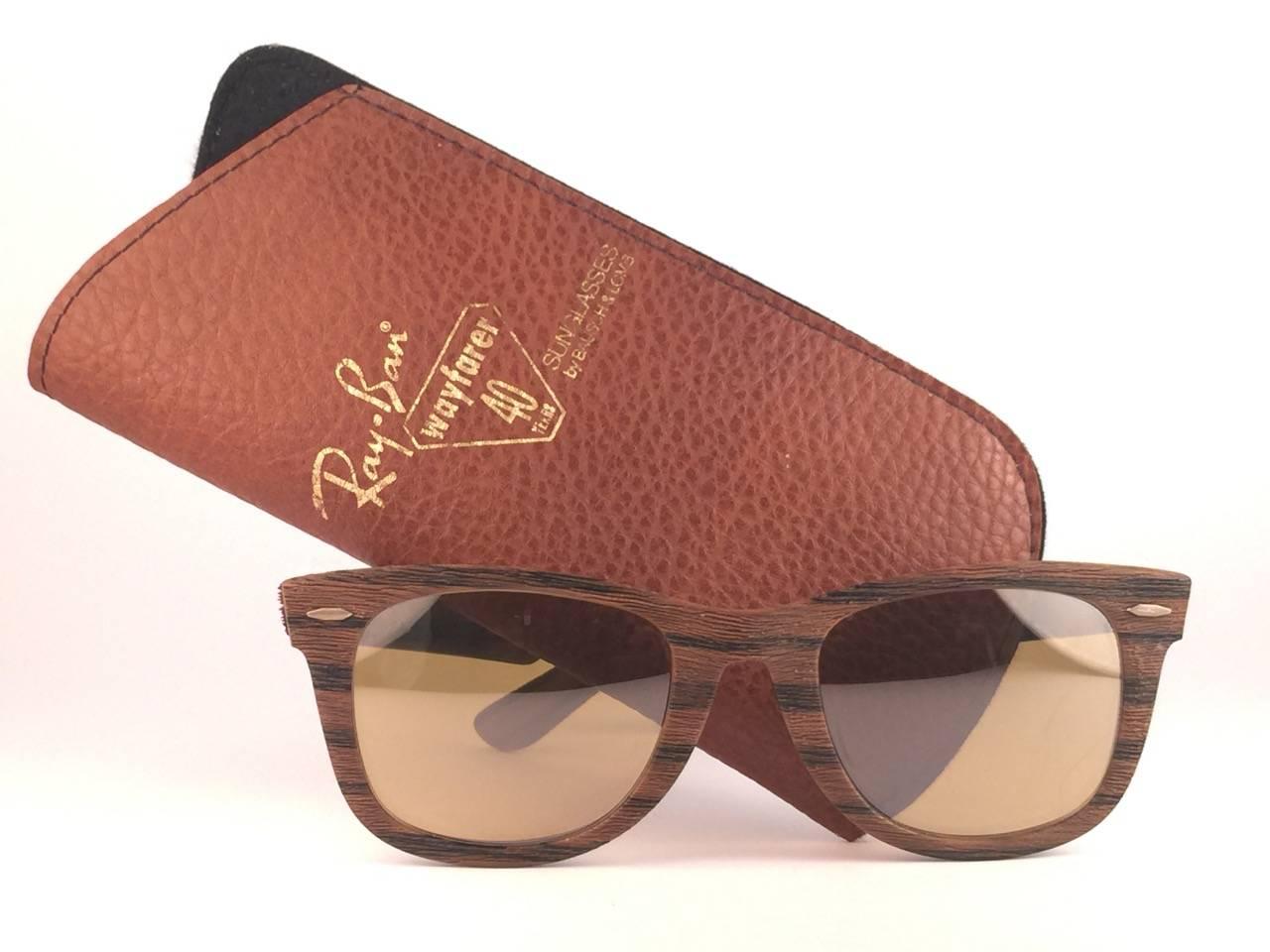 New and Rare collectors item the ultra rare edition of the classic Wayfarer: The Woodies. 
These were made in 3 colors, from light brown to dark brown. These are the dark Tiki edition. Sporting RB50 The General lenses. 5022, the classic size. 
Frame