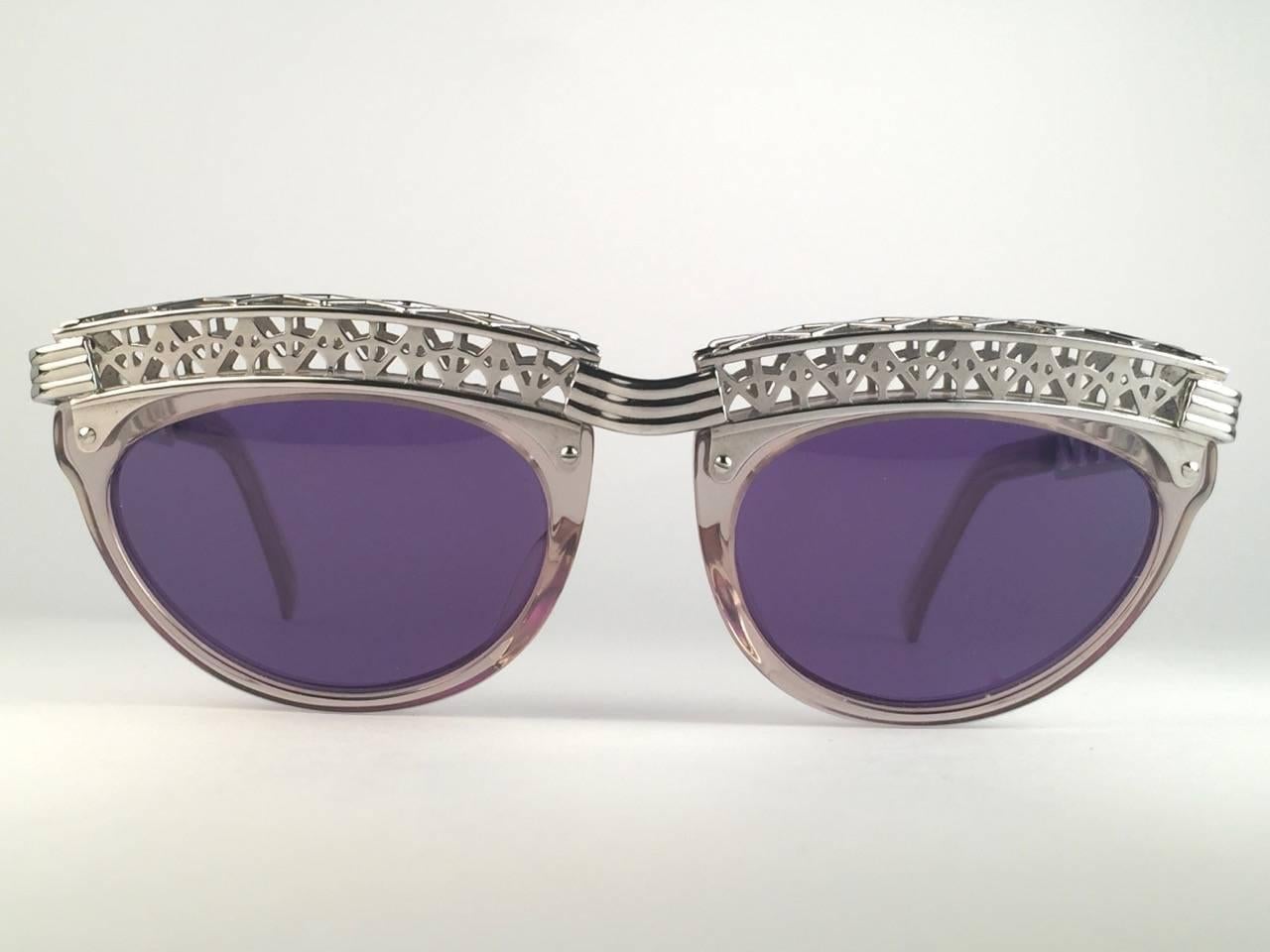 Superb Collectors Item!!
New Jean Paul Gaultier 56 0271 Eiffel Tower clear frame. 
Spotless dark purple lenses that complete a ready to wear JPG look.

Amazing design with strong yet intricate details.
Design and produced in the 1900's.
New, never