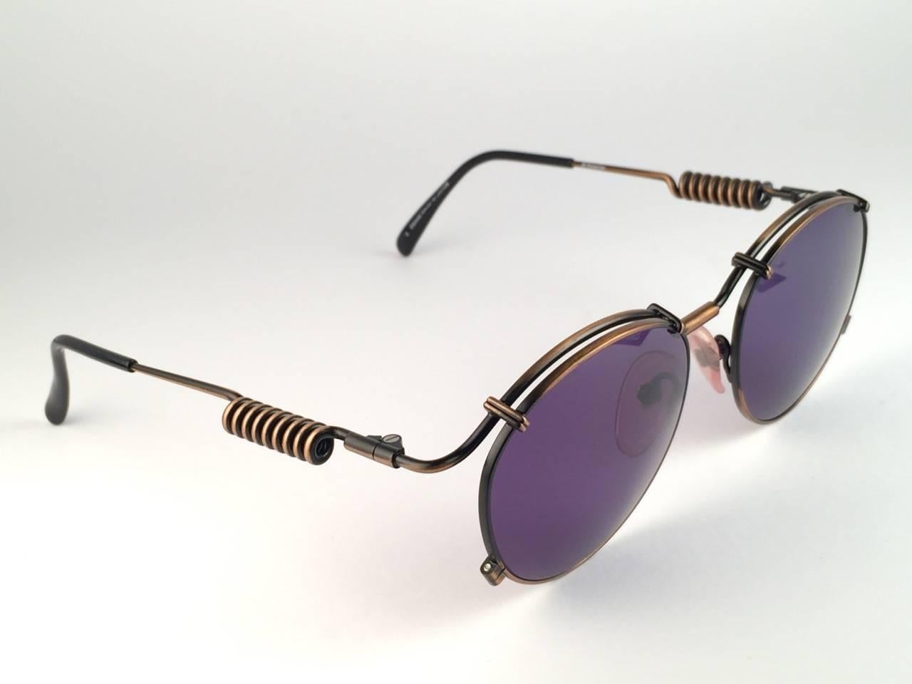 
New Jean Paul Gaultier 56 9174 Black & Copper Details frame. 
Dark Blue lenses that complete a ready to wear JPG look.

Amazing design with strong yet intricate details.
Design and produced in the 1900's.
New, never worn or displayed.
A true