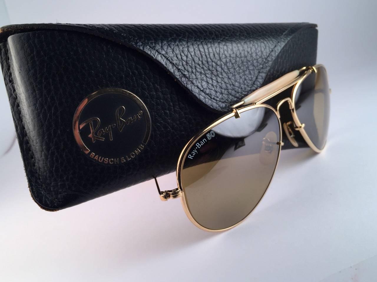 New 50th Anniversary Edition 1937-1987 Ray Ban The General Gold Bravura frame with the extra strong temples. RB 50 Ambermatic mirror lenses.
Ray Ban 50 written on the right lens. B&L Ray Ban Usa. Under the bridge 58 [] 14. Comes with original