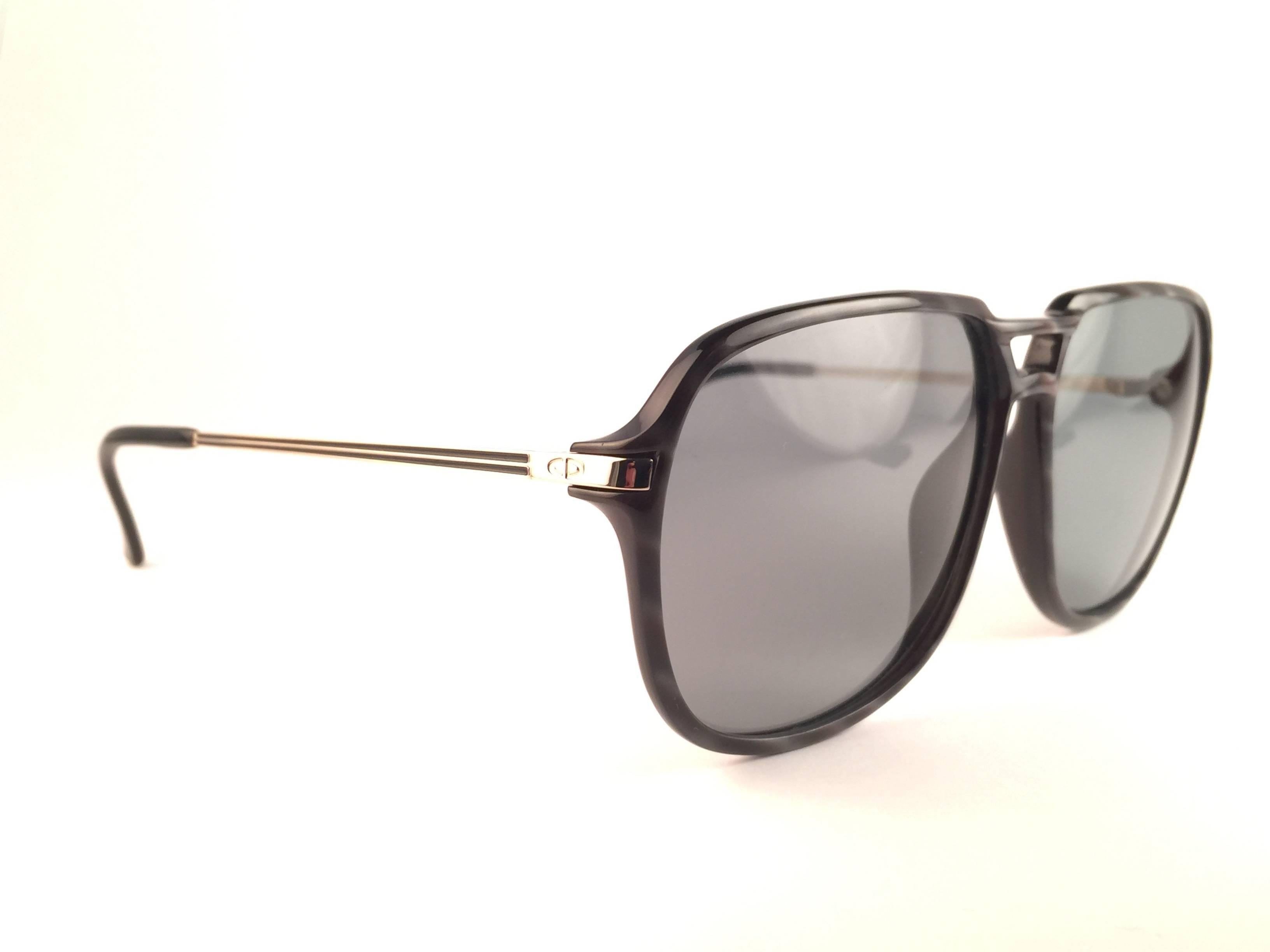 
New Vintage Christian Dior 2296 90 Sunglasses oversized black & white stripped frame with spotless smoke grey lenses 1970’s made by Optyl. 

Manufactured in Austria
 
New! never worn or displayed. 

Flawless pair!!!
