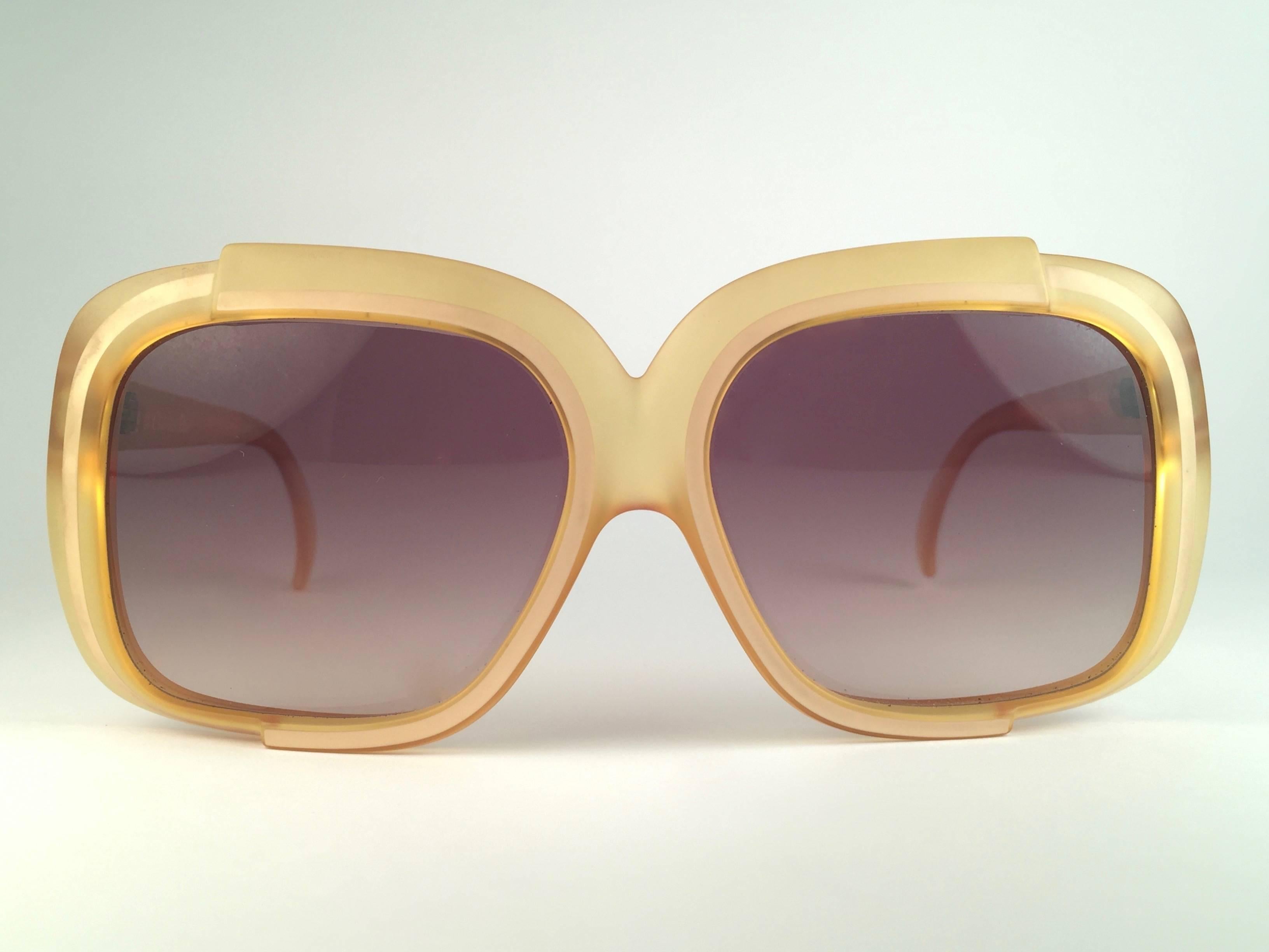 New Vintage Christian Dior 2042 70 Yellow matte with beige accents frame with spotless light brown gradient lenses. 

Made in Austria.
 
Produced and design in 1970's.

New, never worn or displayed. Comes with its original silver Christian Dior