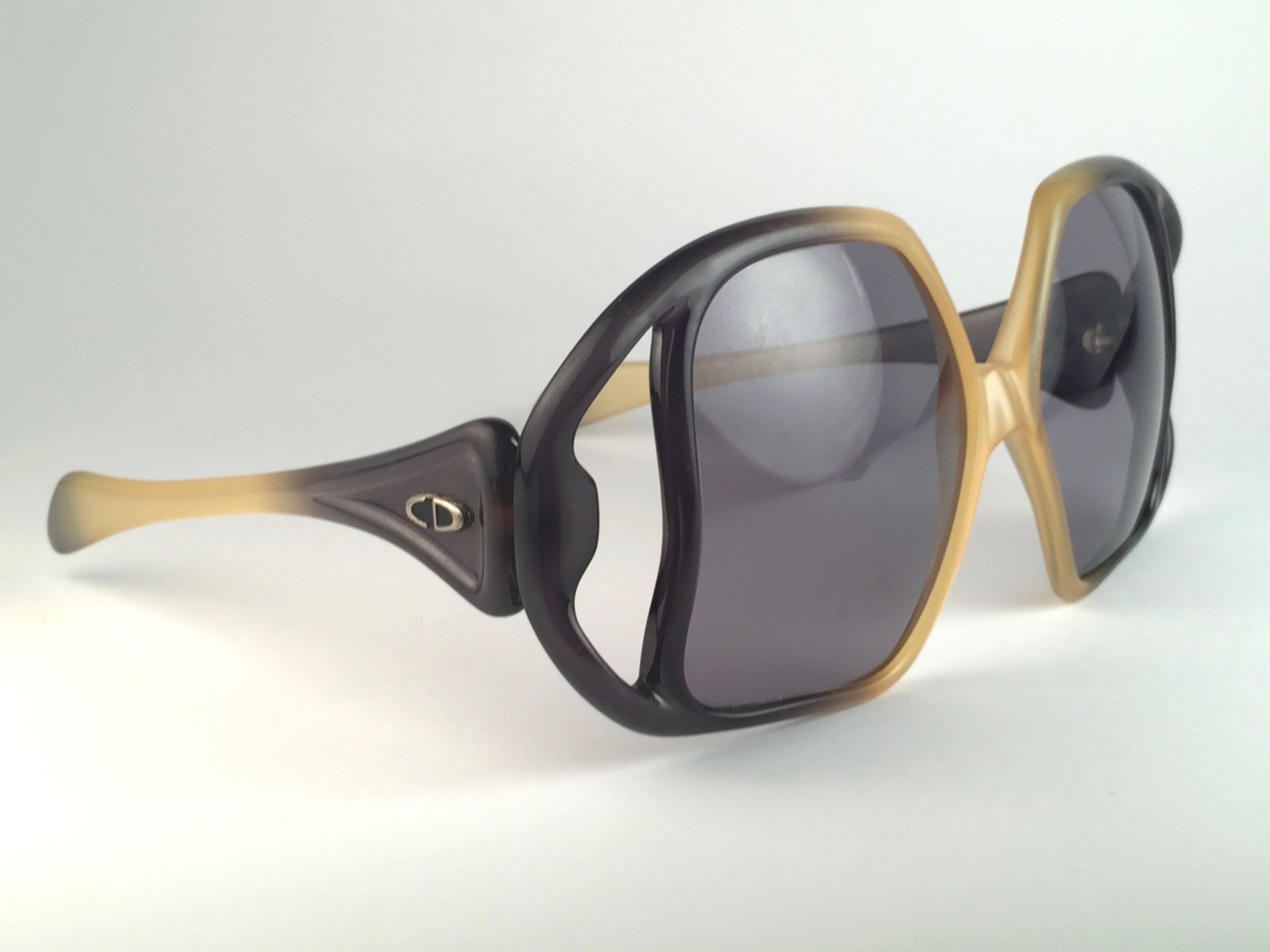 New Vintage Christian Dior D02 Massive Avant Garde Two tone frame with spotless smoke grey gradient lenses. 

Made in Germany.
 
Produced and design in 1970's.

A collector’s piece! 
This pair have minor sign of wear.


