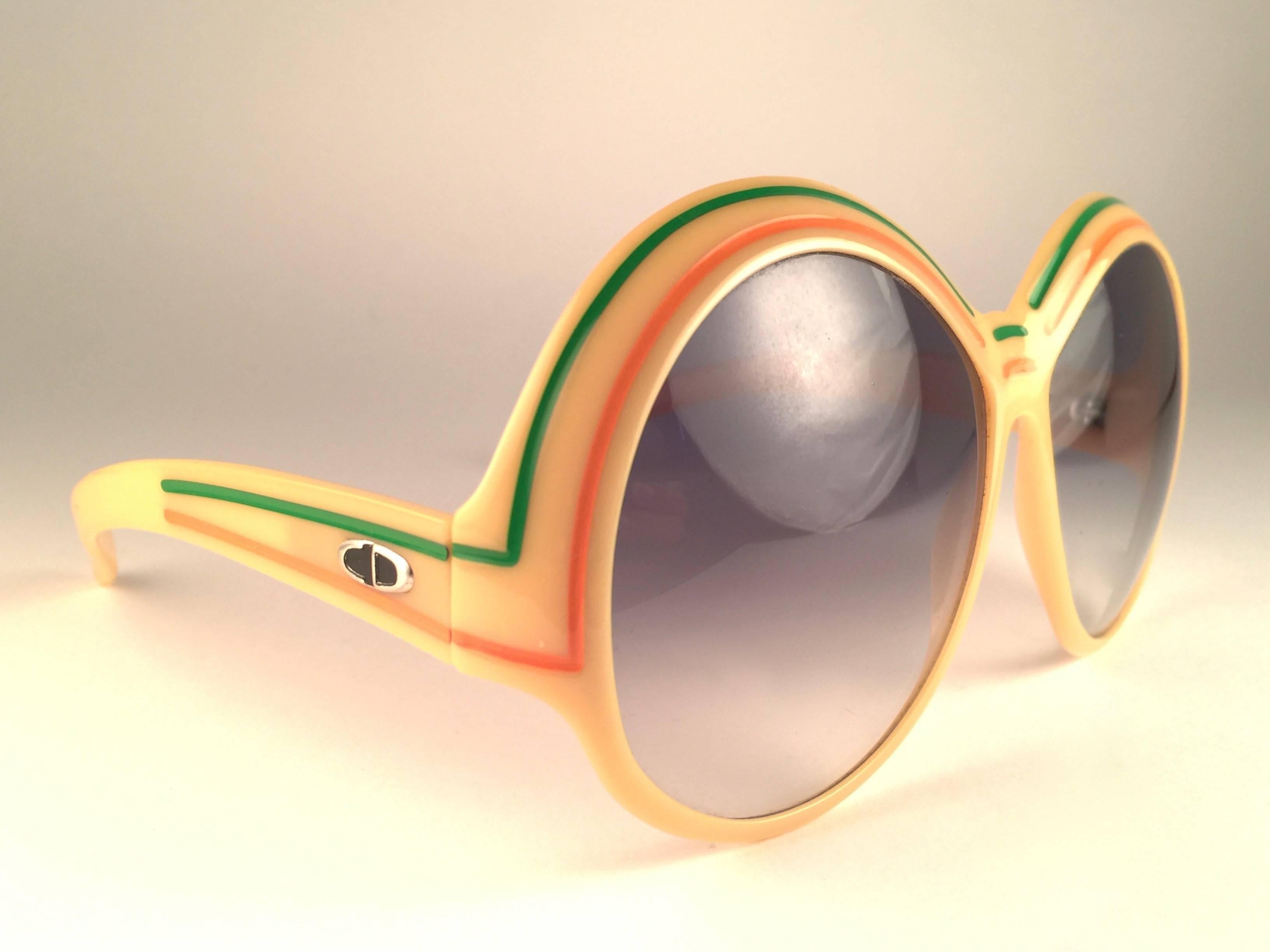 New Vintage Christian Dior 2040 70 Yellow with green and orange accents frame with spotless light blue gradient lenses. 

Made in Germany.
 
Produced and design in 1970's.

New, never worn or displayed. 
