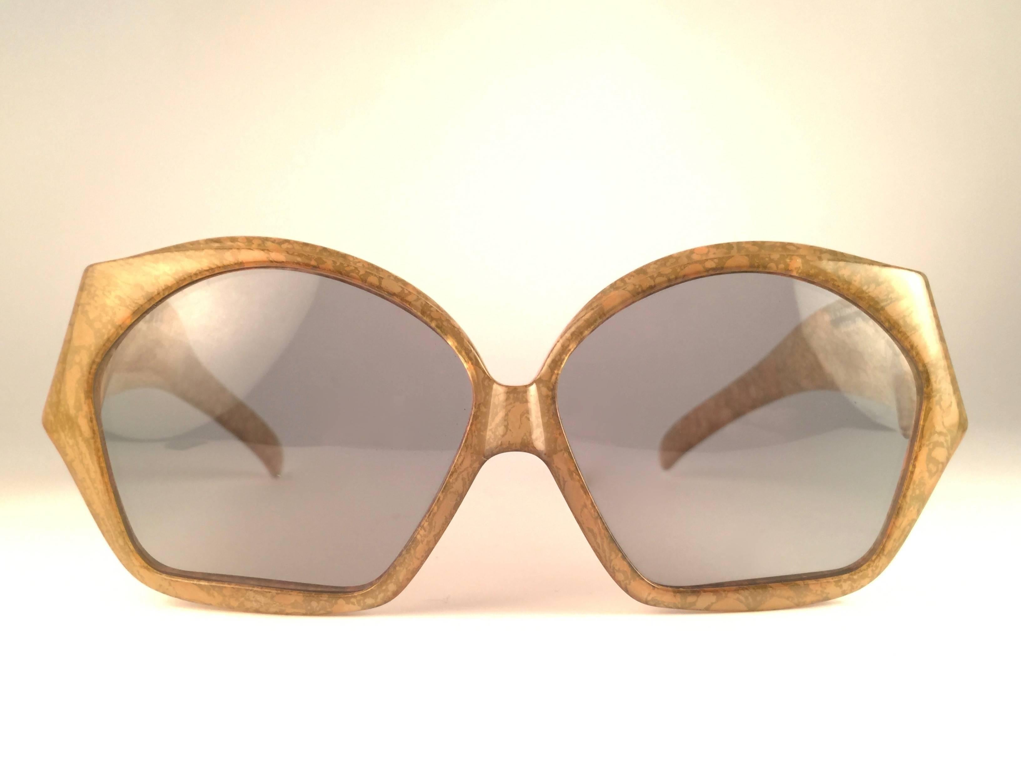 New Vintage Christian Dior 2028 60 Jasped marbled green frame with spotless light grey lenses. 

Made in Germany.
 
Produced and design in 1970's.

New, never worn or displayed. Comes with its original silver Christian Dior Lunettes sleeve.
