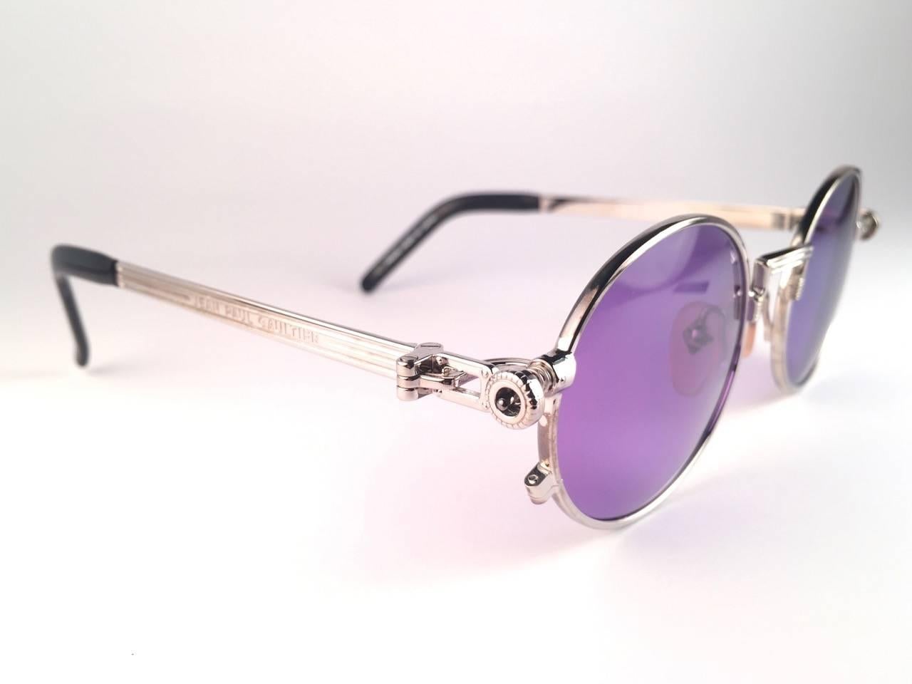 New Jean Paul Gaultier 56 4178 round silver metal frame.  Flat dark purple lenses that complete a ready to wear JPG look.  Amazing design with strong yet intricate details. Design and produced in the 1990's. New, never worn or displayed. A true
