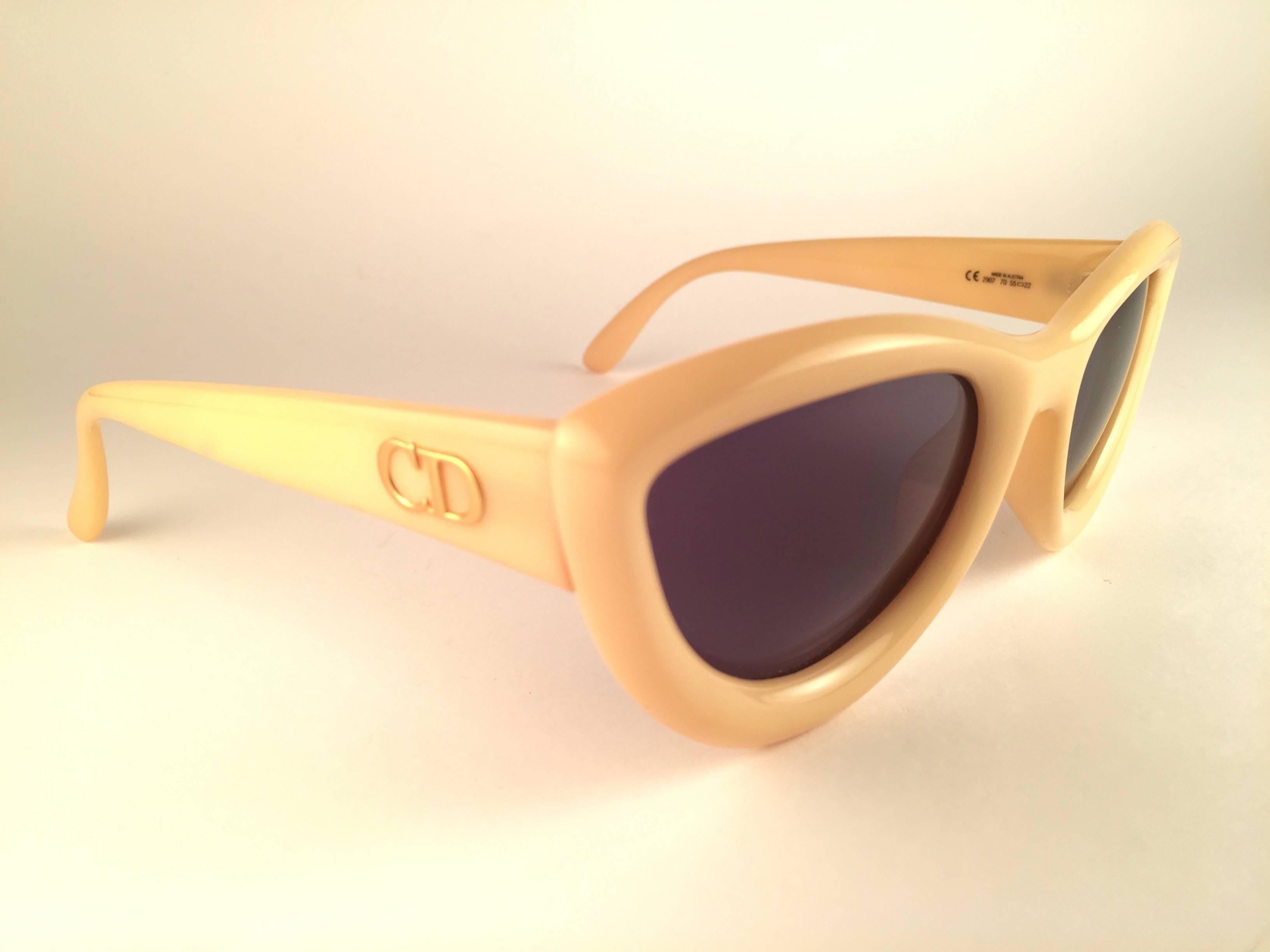 New Vintage Christian Dior 2907 70 Beige Cate eye frame with spotless deep brown lenses.   
Made in Austria.  
Produced and design in 1990's.  
New, never worn or displayed.
Comes with its original silver Christian Dior Lunettes sleeve
