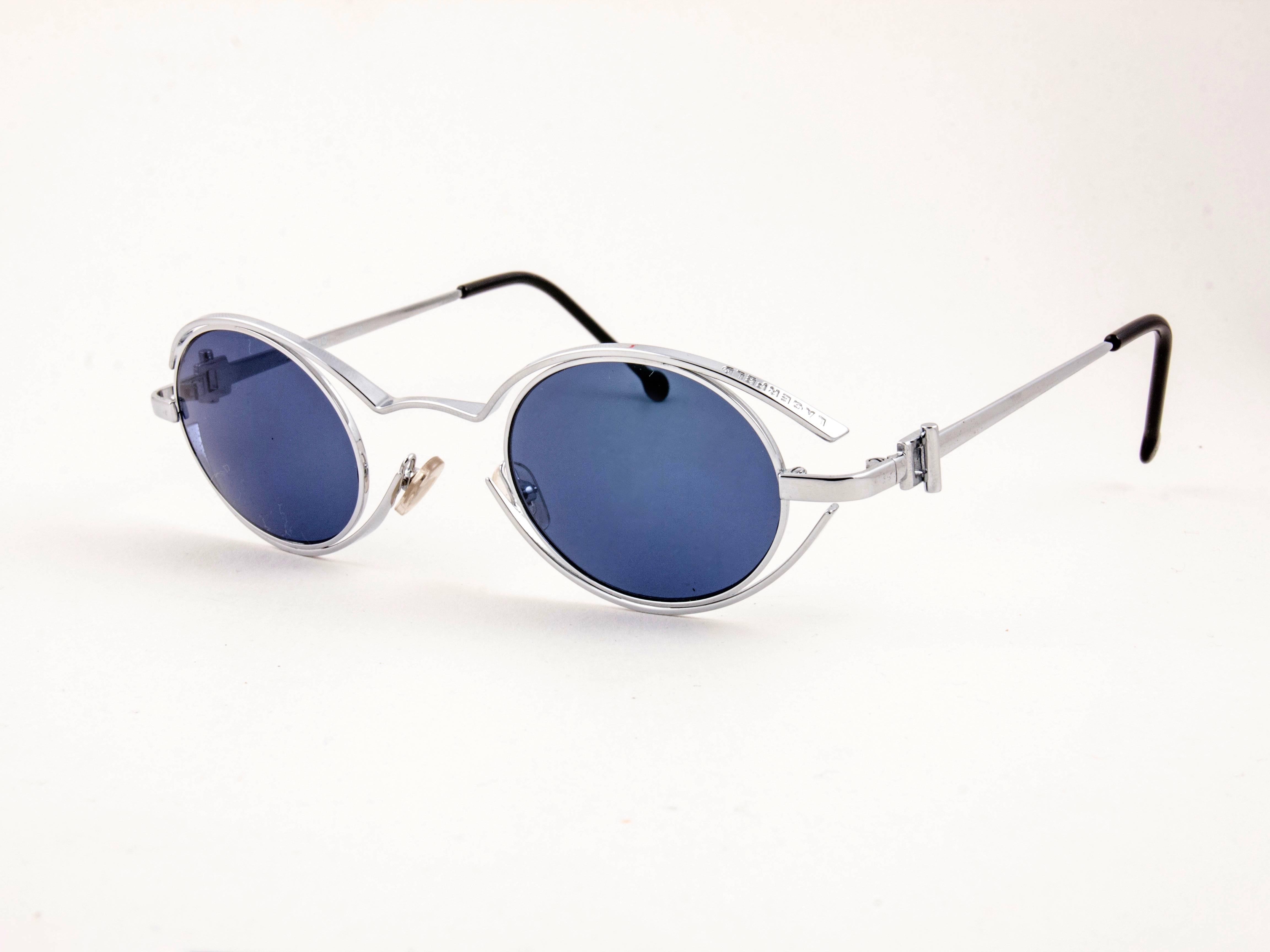 New Vintage amazing pair of vintage 1980's 4123 04 Karl Lagerfeld oval silver sunglasses framing a pair of smoke grey lenses.
 
 New, never worn or displayed. Designed and produced in France.
