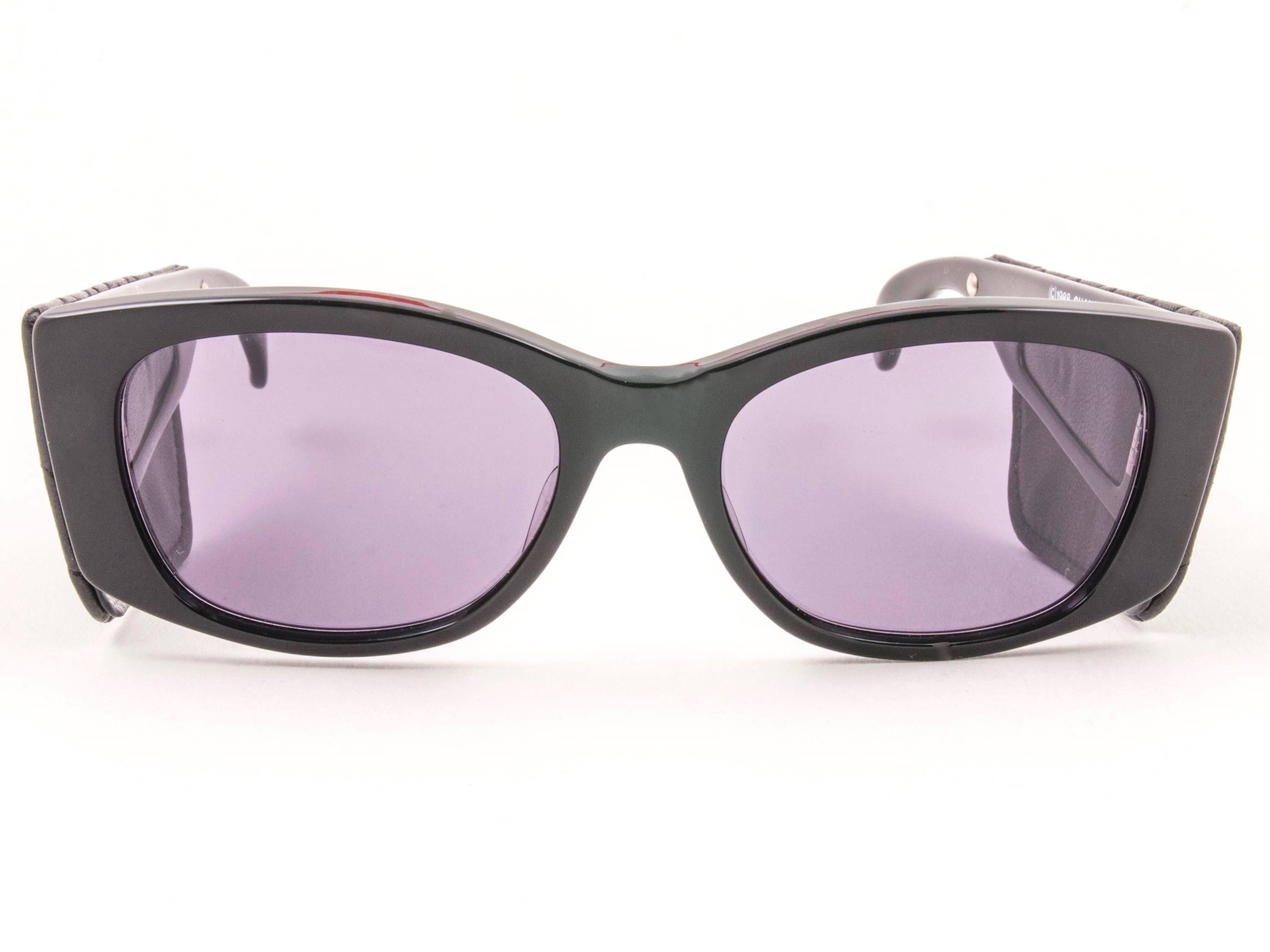 New Vintage Chanel Black quilted sunglasses with spotless smoke grey lenses for a total incognito look.

New, never worn or displayed, this pair of Chanel sunglasses is an absolute showstopper.