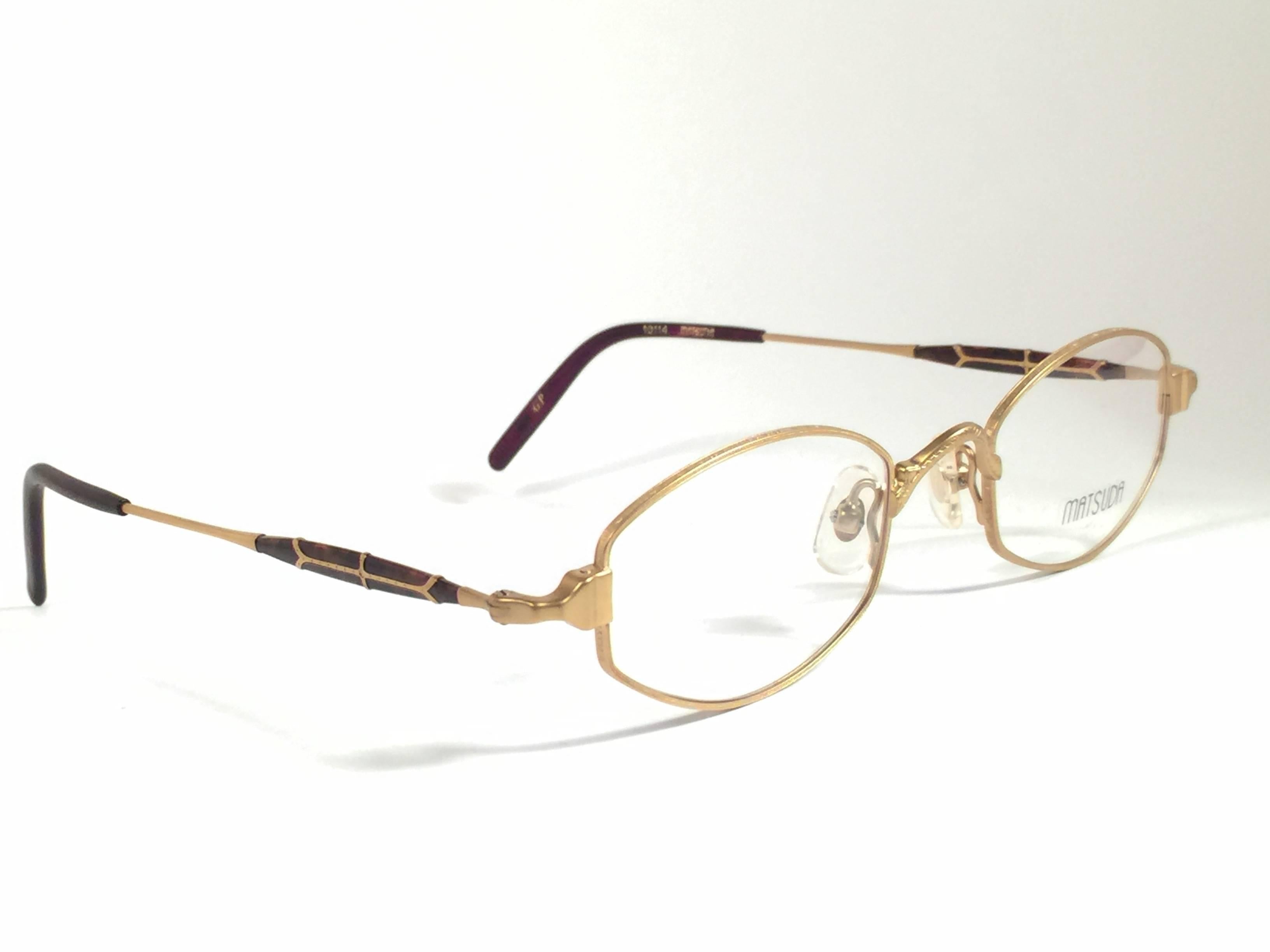 
Cult brand Matsuda signed this ultra chic pair of matte gold frame with elaborated accents sunglasses. 

An amazing pair for your prescription sunglasses.

Superior quality and design. 

New, never worn or displayed. Made in japan.

