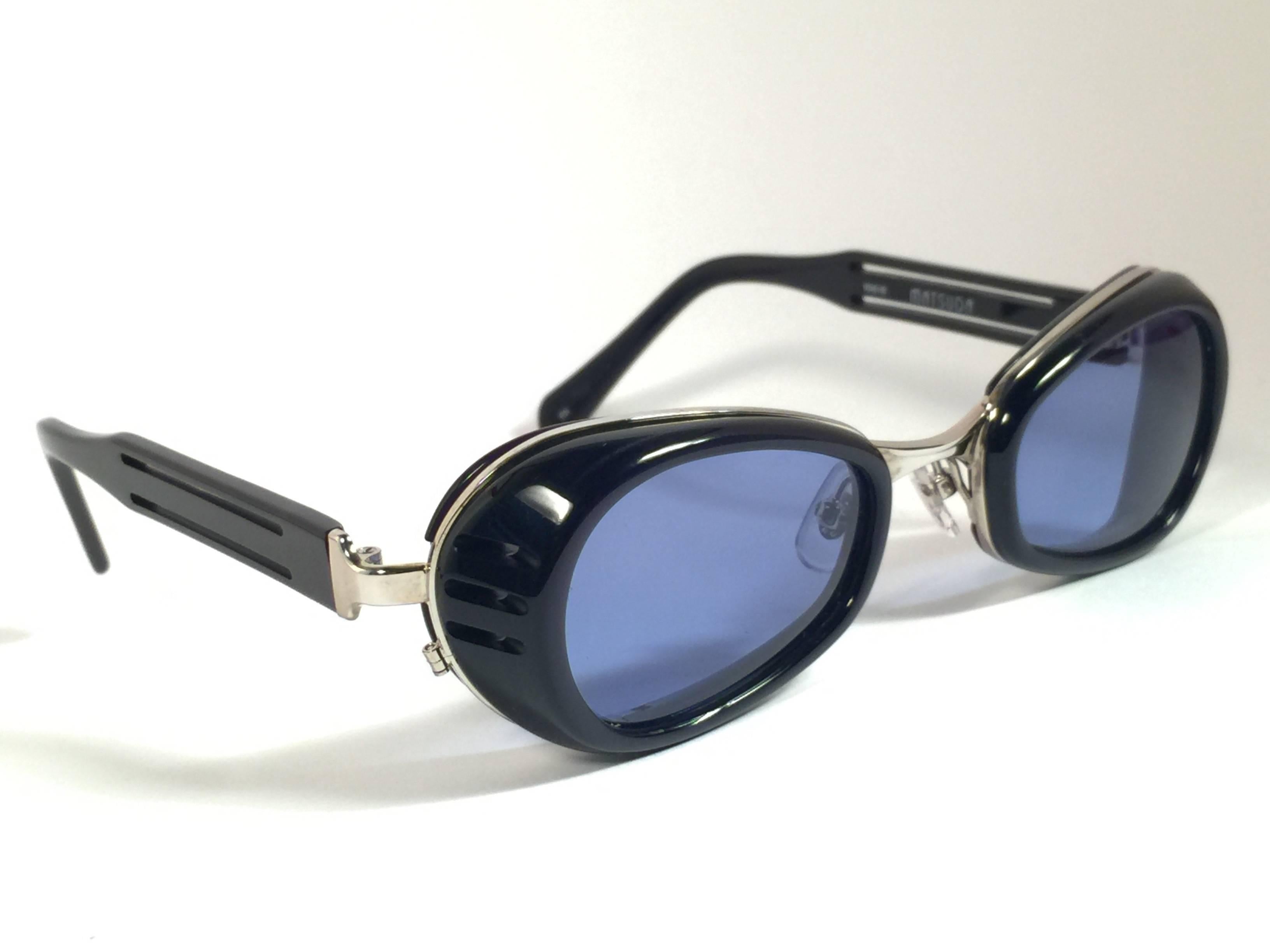 Cult brand Matsuda signed this ultra chic pair of dark blue with silver accents sunglasses. 

Spotless smoke grey lenses.

Superior quality and design. 

New, never worn or displayed. Made in japan.

