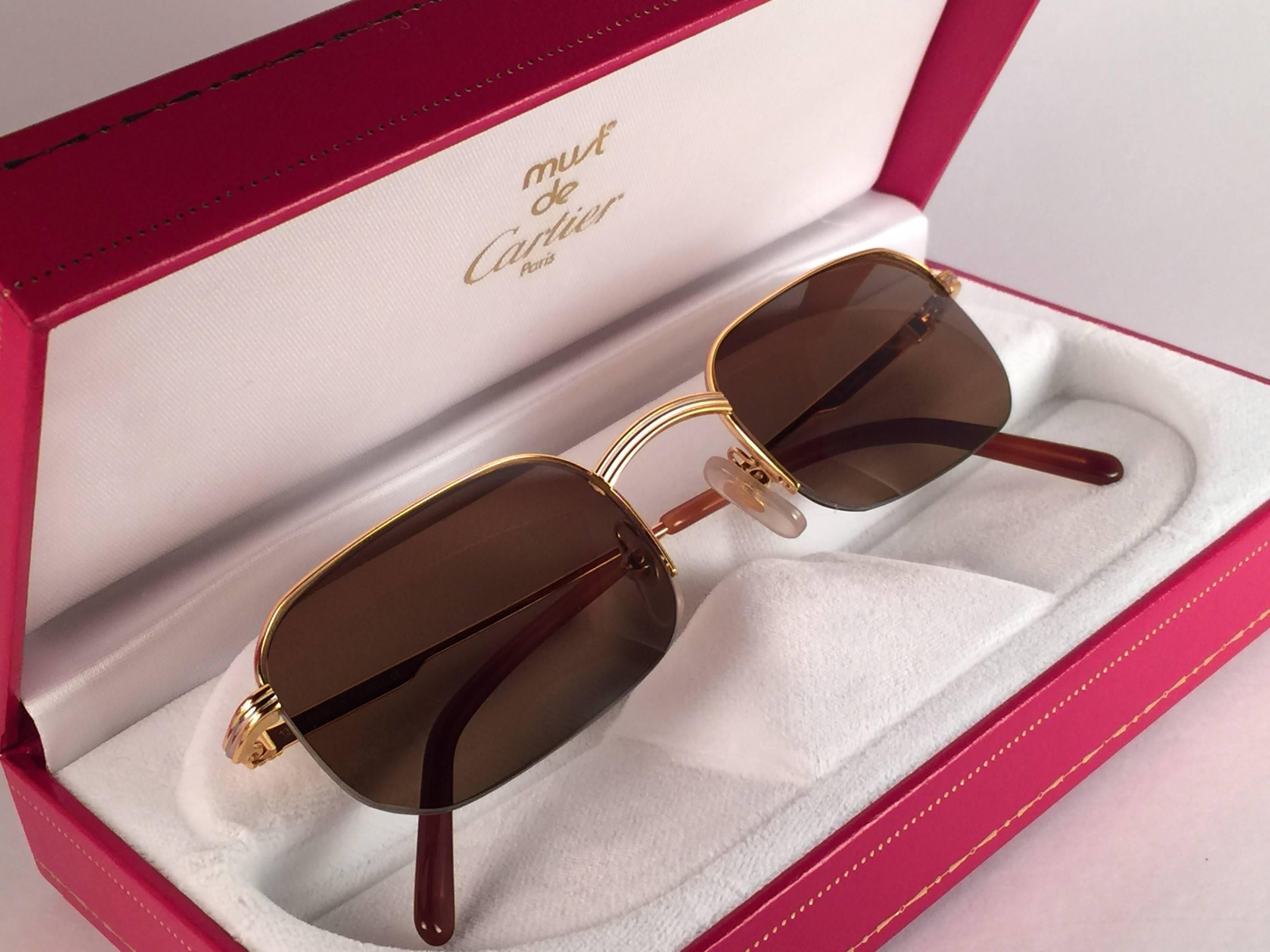 New 1990 Cartier Broadway half frame Vendome  49 [] 22 Sunglasses with brown (uv protection) lenses.  All hallmarks. Cartier gold signs on the ear paddles. These are like a pair of jewels on your nose. Beautiful design and a real sign of the times.