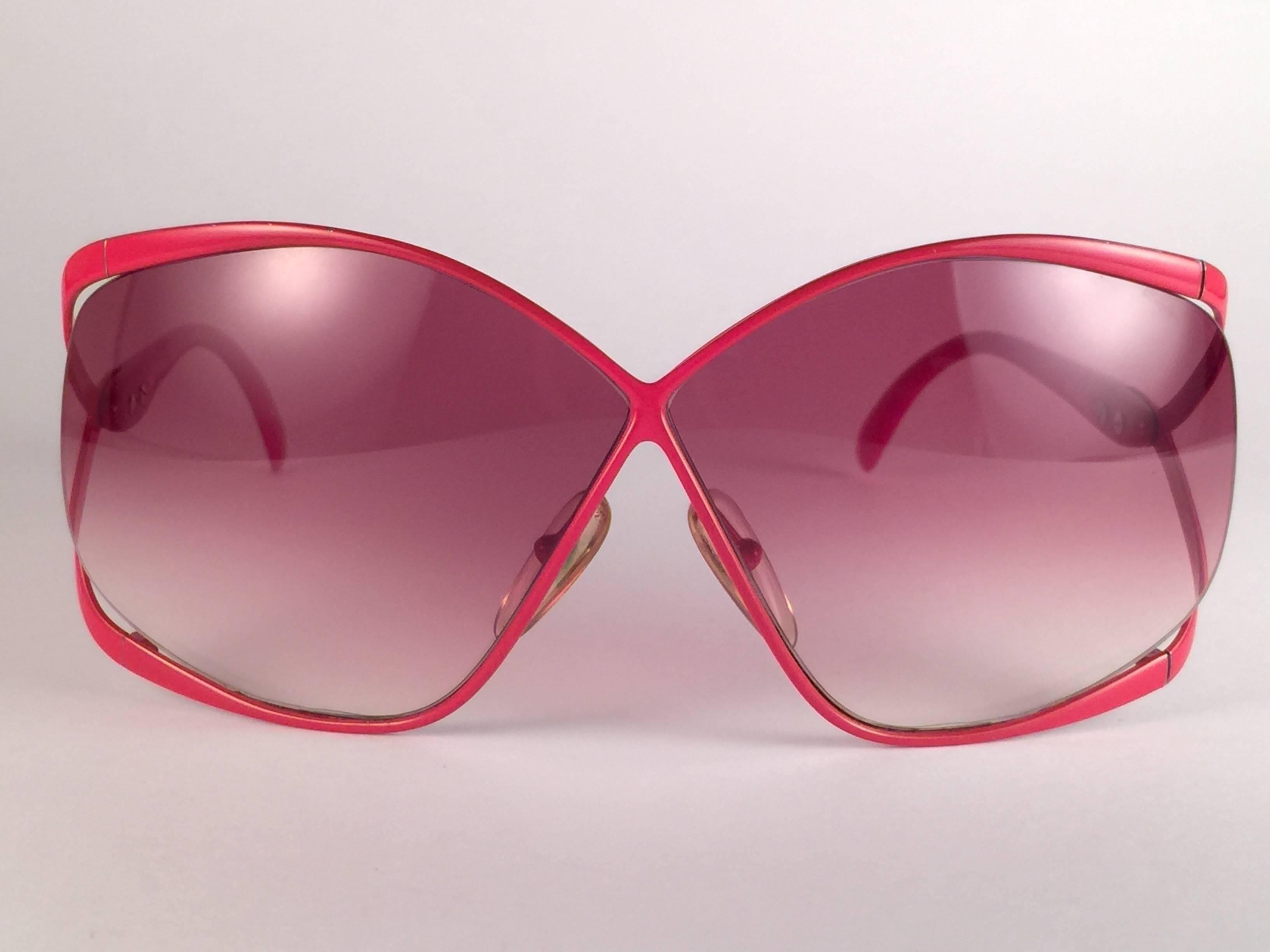 Highly coveted Christian Dior butterly shape in sleek vibrant red. Spotless rose gradient lenses. A collector’s piece!  Come with its original Christian Dior lunettes sleeve.  New, never worn or displayed. Made in Austria.