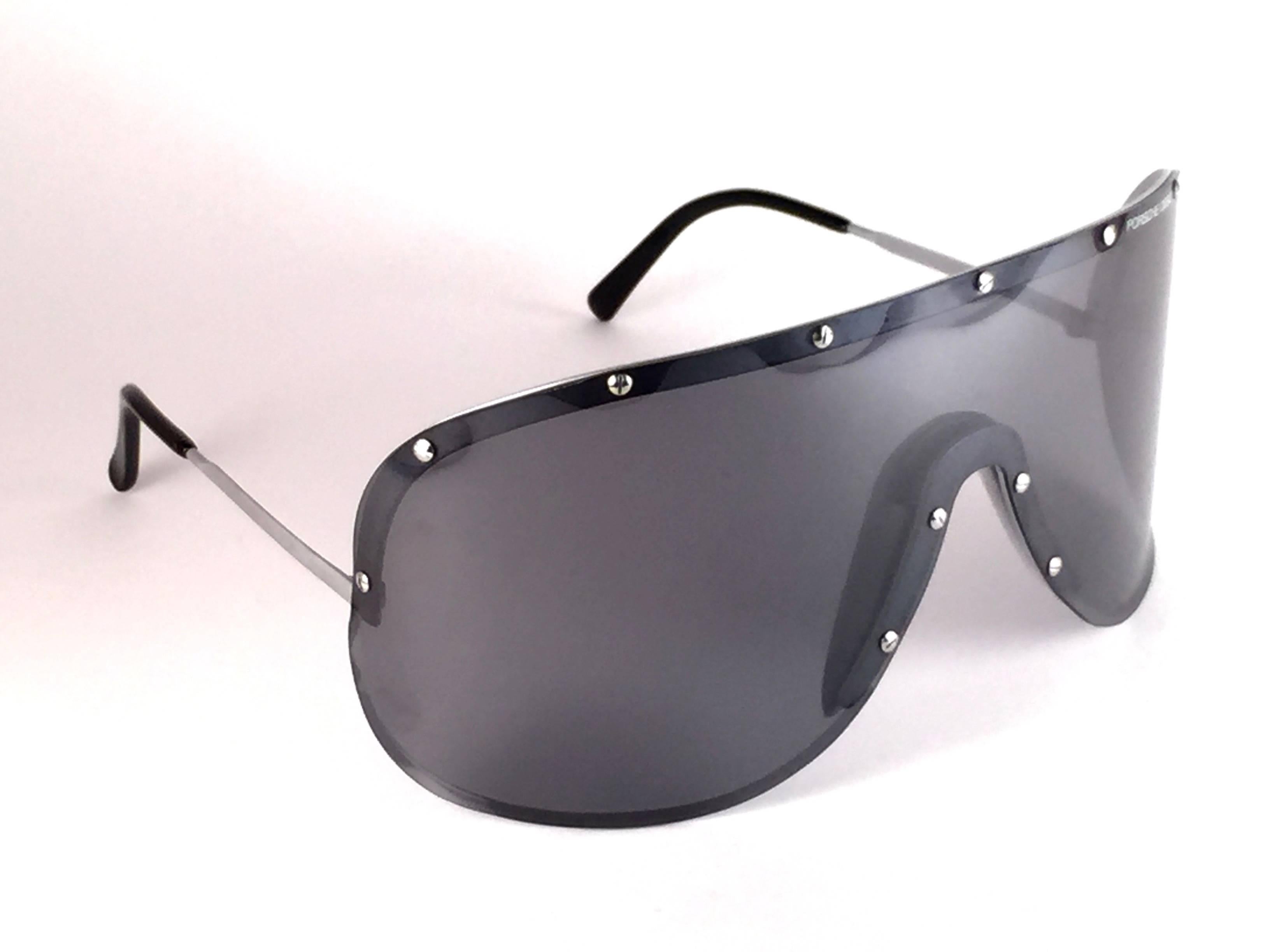 New and ultra rare collectors item from the 1980's, 30 years old Porsche Design 5620 silver grey shield frame with smoke grey mono lens. 
Amazing craftsmanship and quality. it has light wear due to three decades of storage. 
The very same model worn