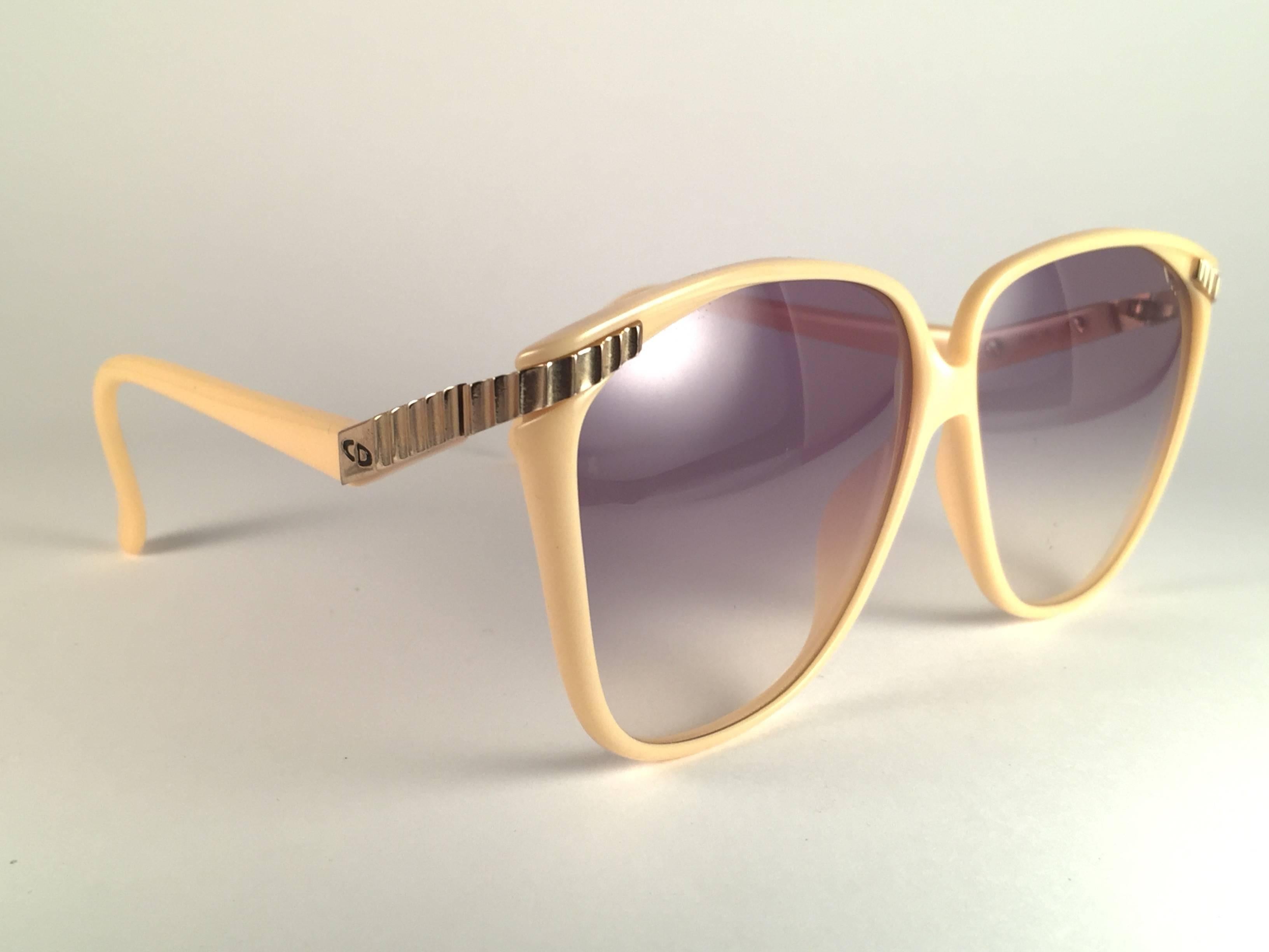 New Vintage Christian Dior 2279 beige with gold accents frame with spotless light blue gradient lenses.   Made in Austria.  Produced and design in 1980's.  New, never worn or displayed. Comes with its original silver Christian Dior Lunettes sleeve.
