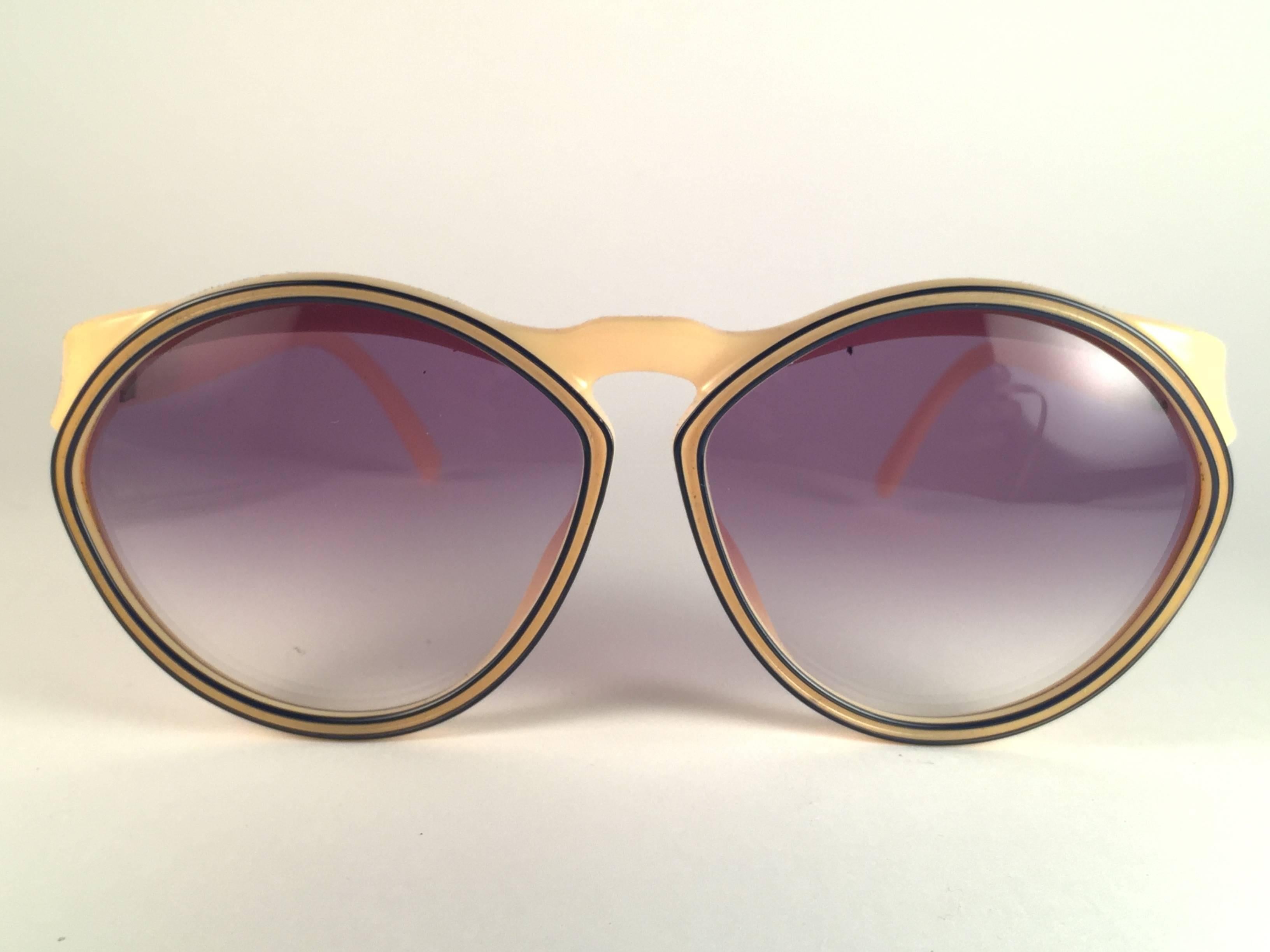 New Vintage Christian Dior 2156 70 Beige with blue  accents frame with spotless light blue gradient lenses.   
Made in Germany.  
Produced and design in 1970's.  
New, never worn or displayed. Comes with its original silver Christian Dior Lunettes