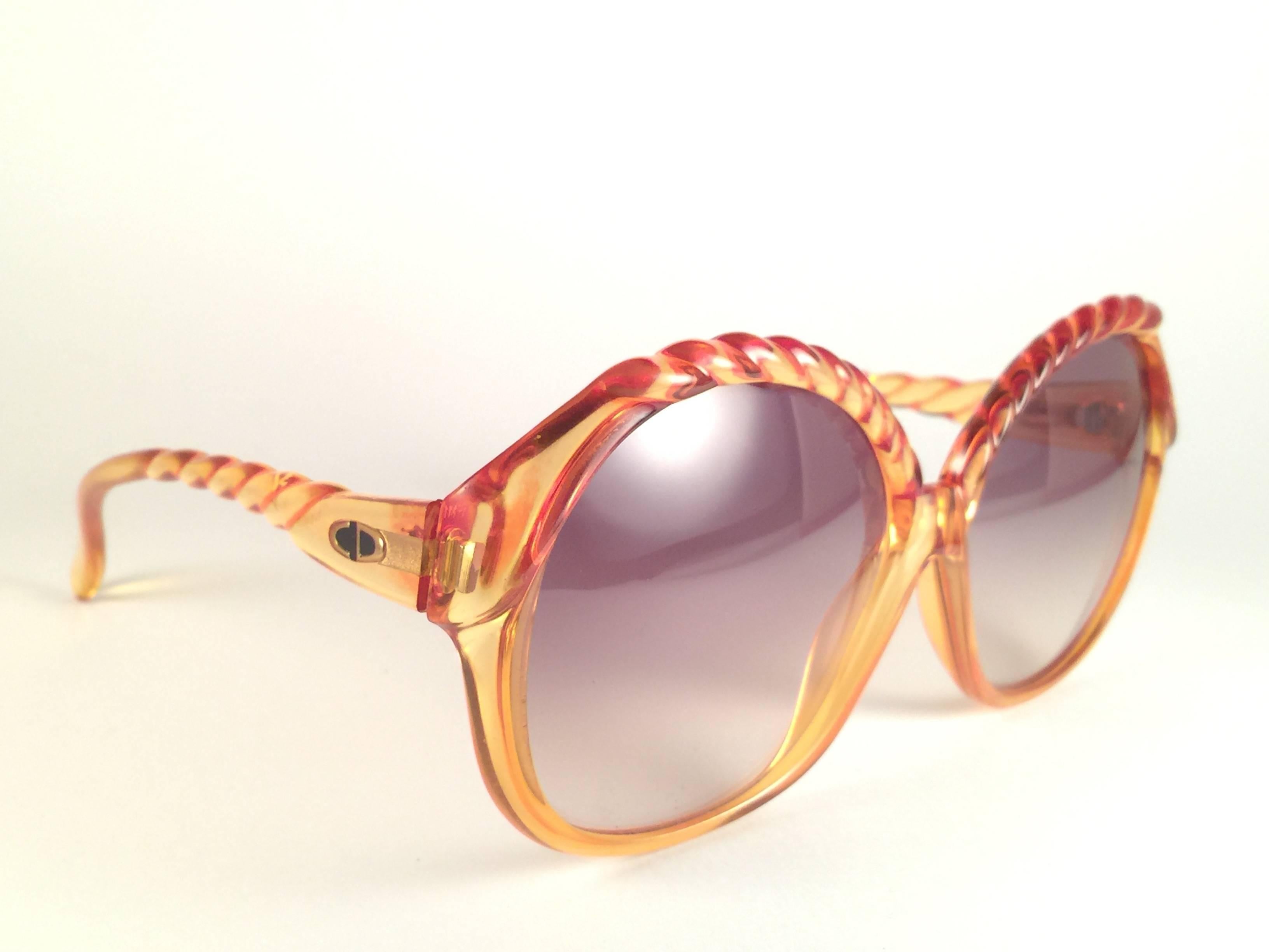 New Vintage Christian Dior 2063 30 Amber with braid accents frame with spotless light brown gradient lenses.   Made in Germany.  Produced and design in 1970's.  
New, never worn or displayed. 
Comes with its original silver Christian Dior Lunettes