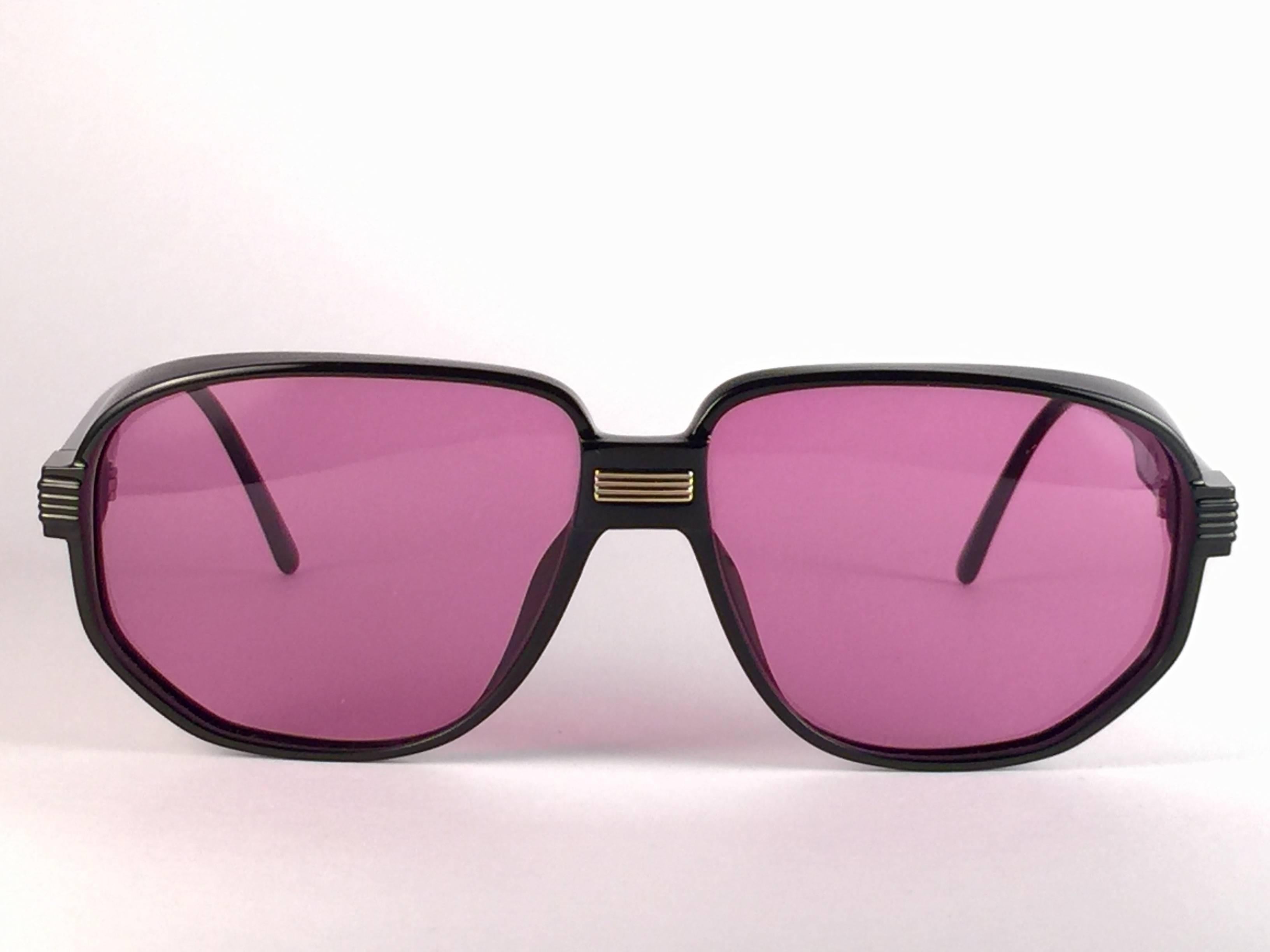 New Vintage Christian Dior 2401 90 sunglasses sleek black with spotless purple lenses. Designed and produced in the1980’s.  
Made by Optyl. Manufactured in Germany.  

New! never worn or displayed.  Flawless pair!