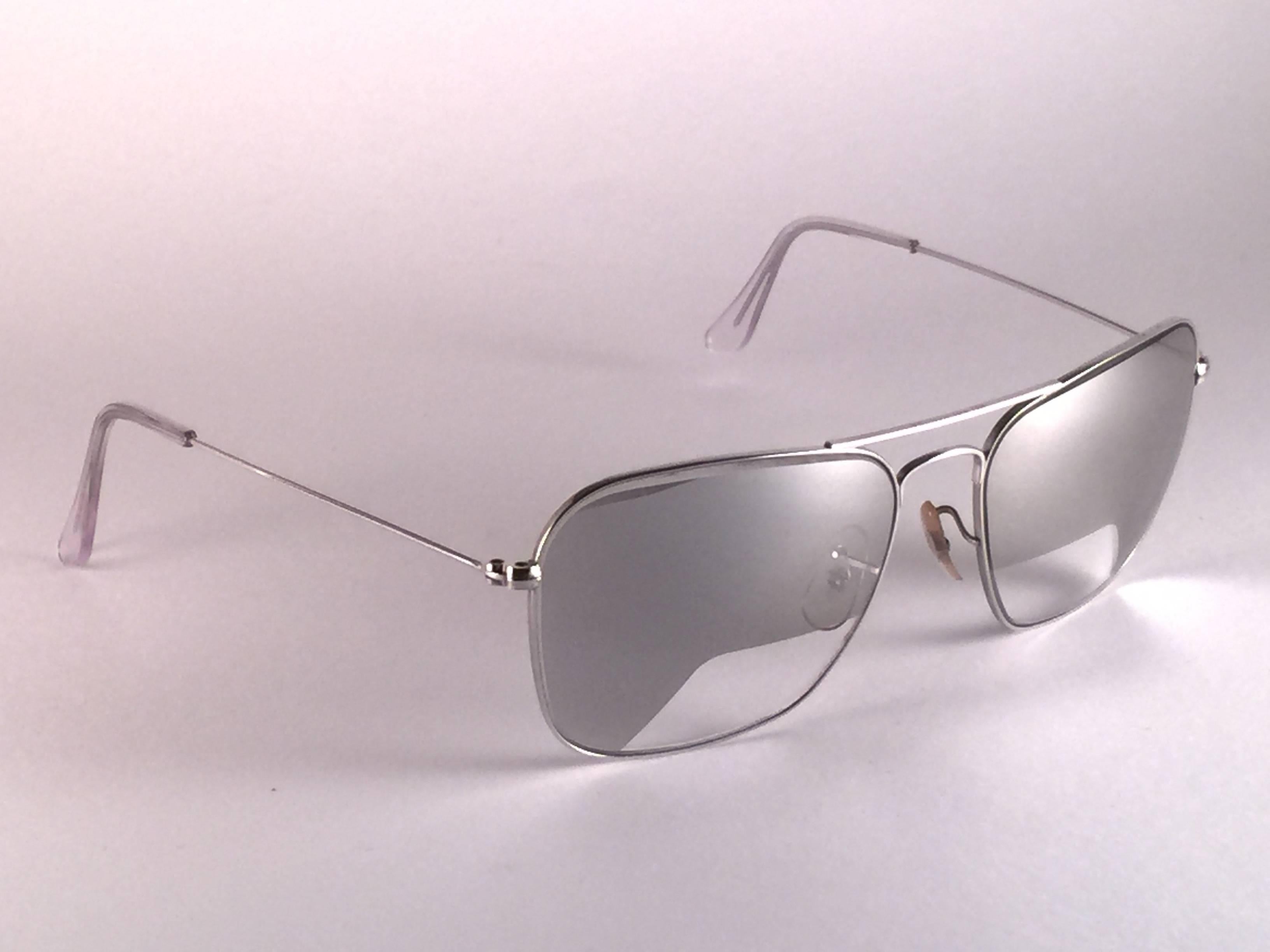 New Ultra Rare Vintage Ray Ban Caravan 10K White Gold in 58MM size. 
Lenses are super rare mirror with special lenses especially crafted for airline pilots to have a clear view over the instruments. B&L etched in the lenses, so mid 1970's.  
Comes
