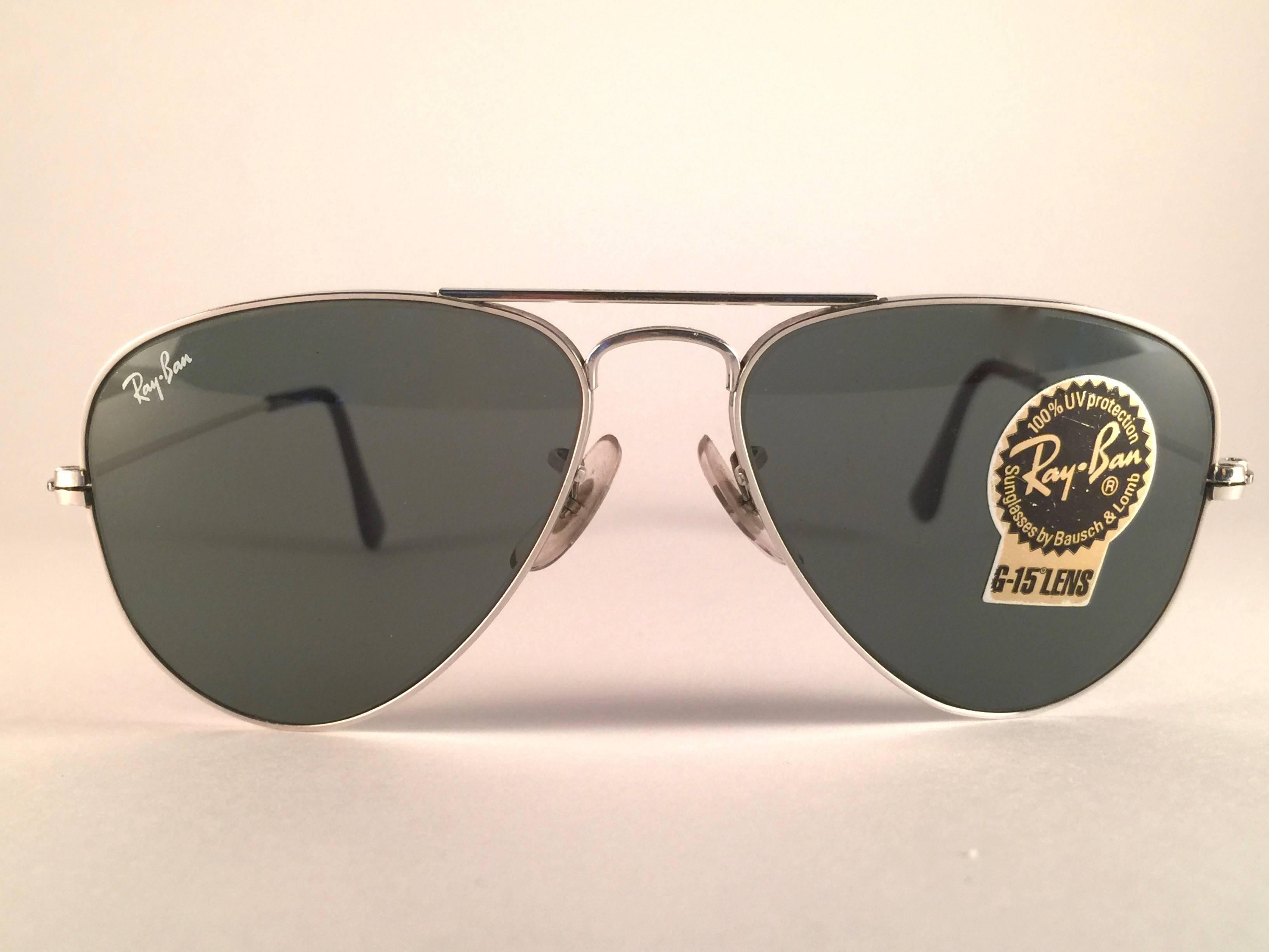New Super special vintage Ray Ban Aviator Silver frame with B&L G15 Grey Lenses in SIZE 52!! 
The smallest size available, suitable for children.  
Comes with its original Ray Ban B&L case.
Rare and hard to find in this new, never worn or displayed