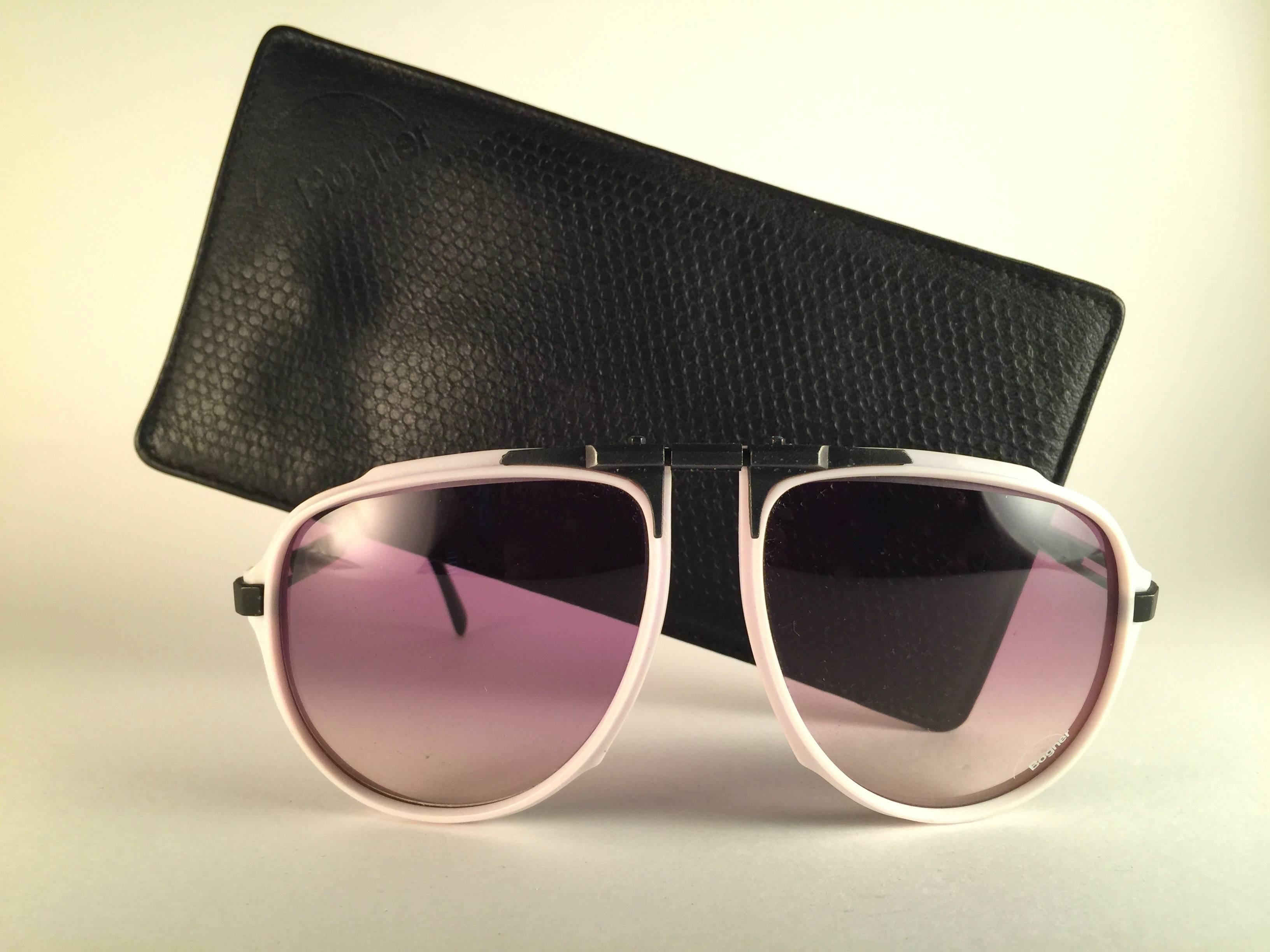 Super rare item. 

New vintage Bogner by Eschenbach sunglasses 7003 white & black with rose gradient lenses. The exact same model used by the late Roger Moore in a 