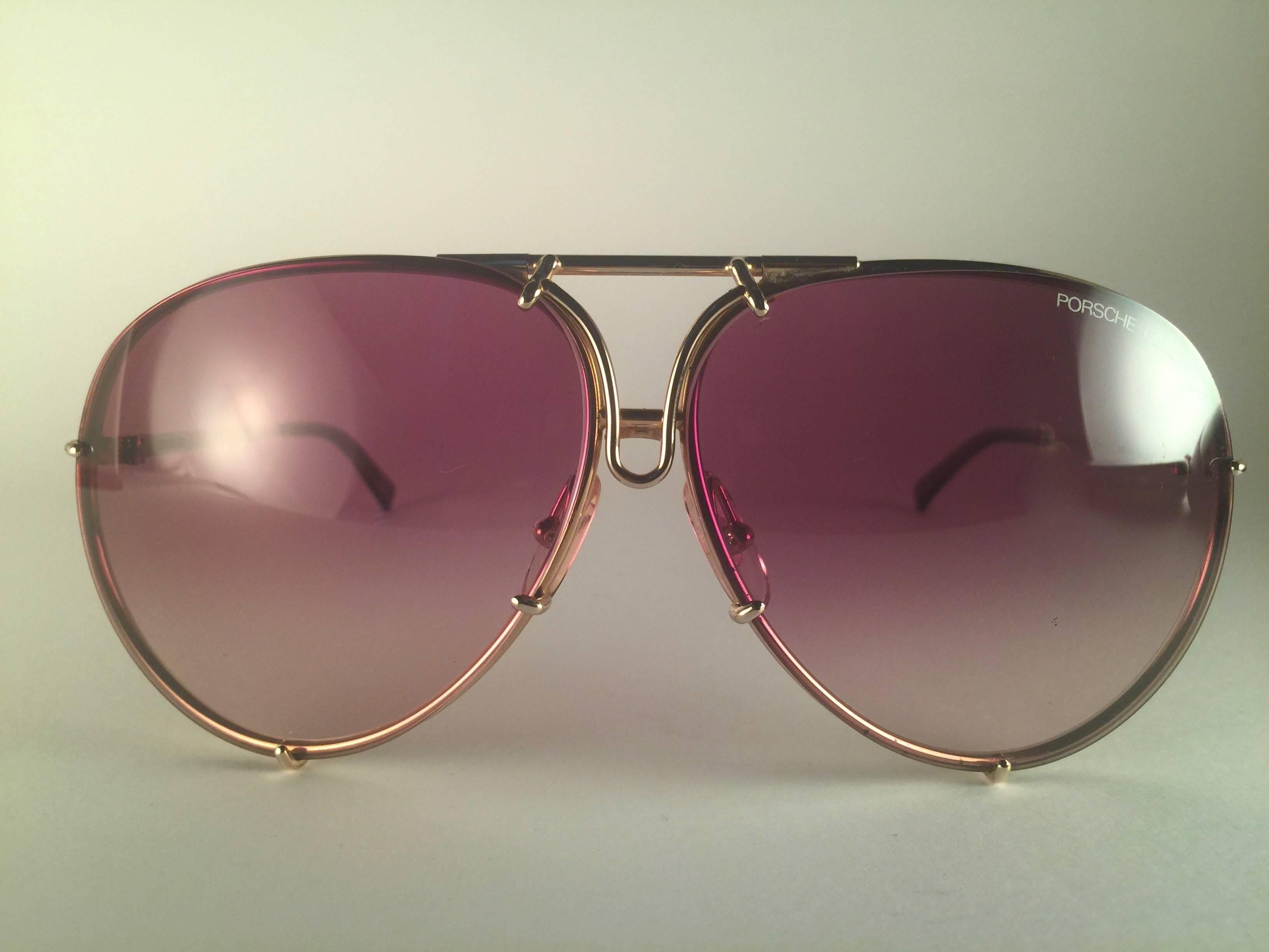 
New 1980's Porsche Design 5623 gold frame with rose gradient lenses. Amazing craftsmanship and quality. 
Comes with the original black Porsche hard case thats has some wear on it due to nearly 40 years of storage. There is no extra set of lenses