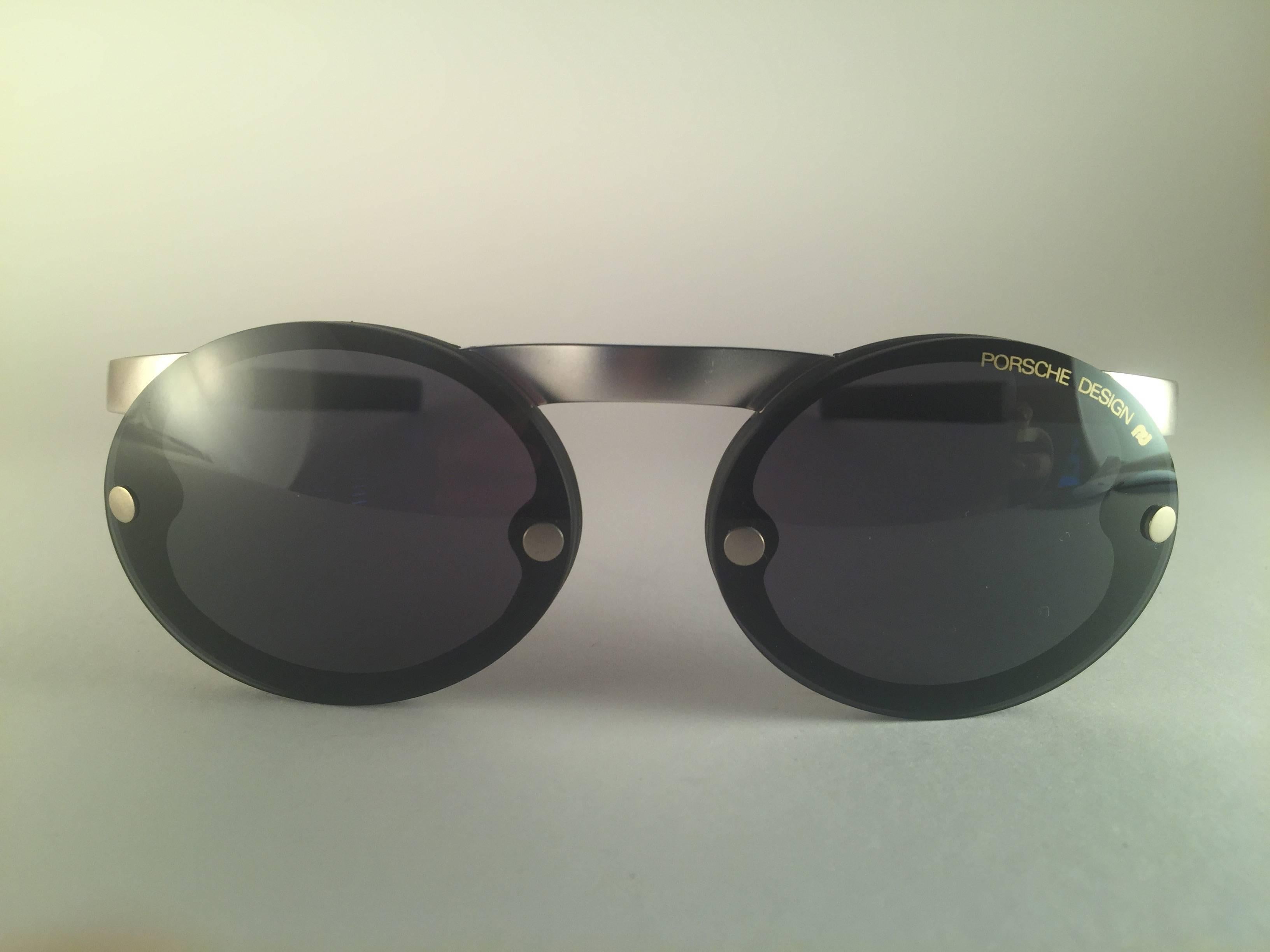 New 1980's Porsche Design 5694 Silver Matte frame. 
Amazing craftsmanship and quality.  
Comes with the original black Porsche hard case thats has some wear on it due to nearly 40 years of storage.  
New, never worn. Made in Austria.