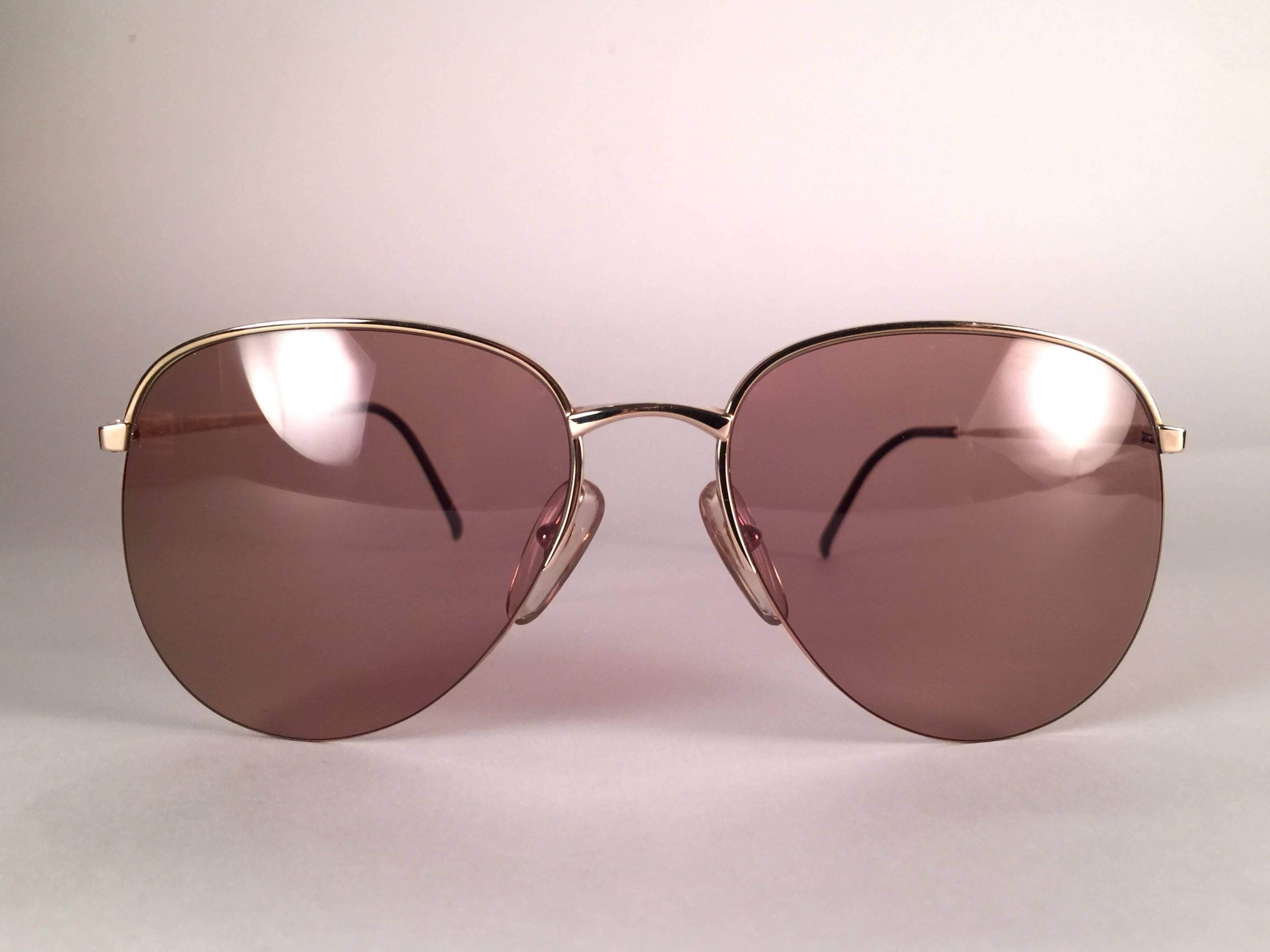 New Vintage Christian Dior 2237 Gold Half frame sunglasses with spotless light brown lenses. 
Designed and produced in the1980’s.  
Made by Optyl. Manufactured in Germany.   New! never worn or displayed. Flawless pair!