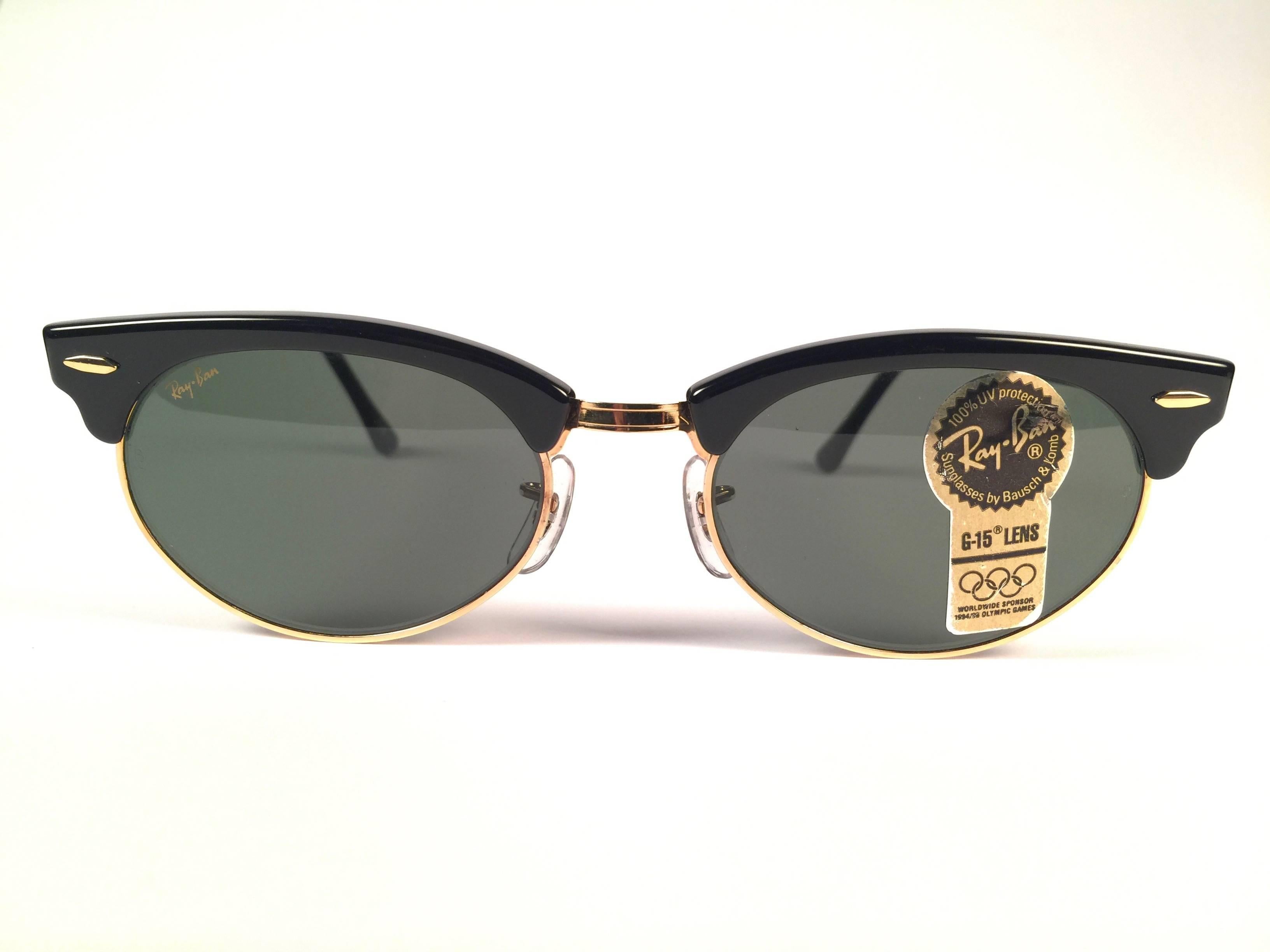 New and rare vintage oval Clubmaster gold and black frame holding a spotless pair of G 15 grey lenses.  New, never worn or displayed. This pair may have minor sign of wear due to nearly 40 years of storage.   
Designed and Produced in USA.
