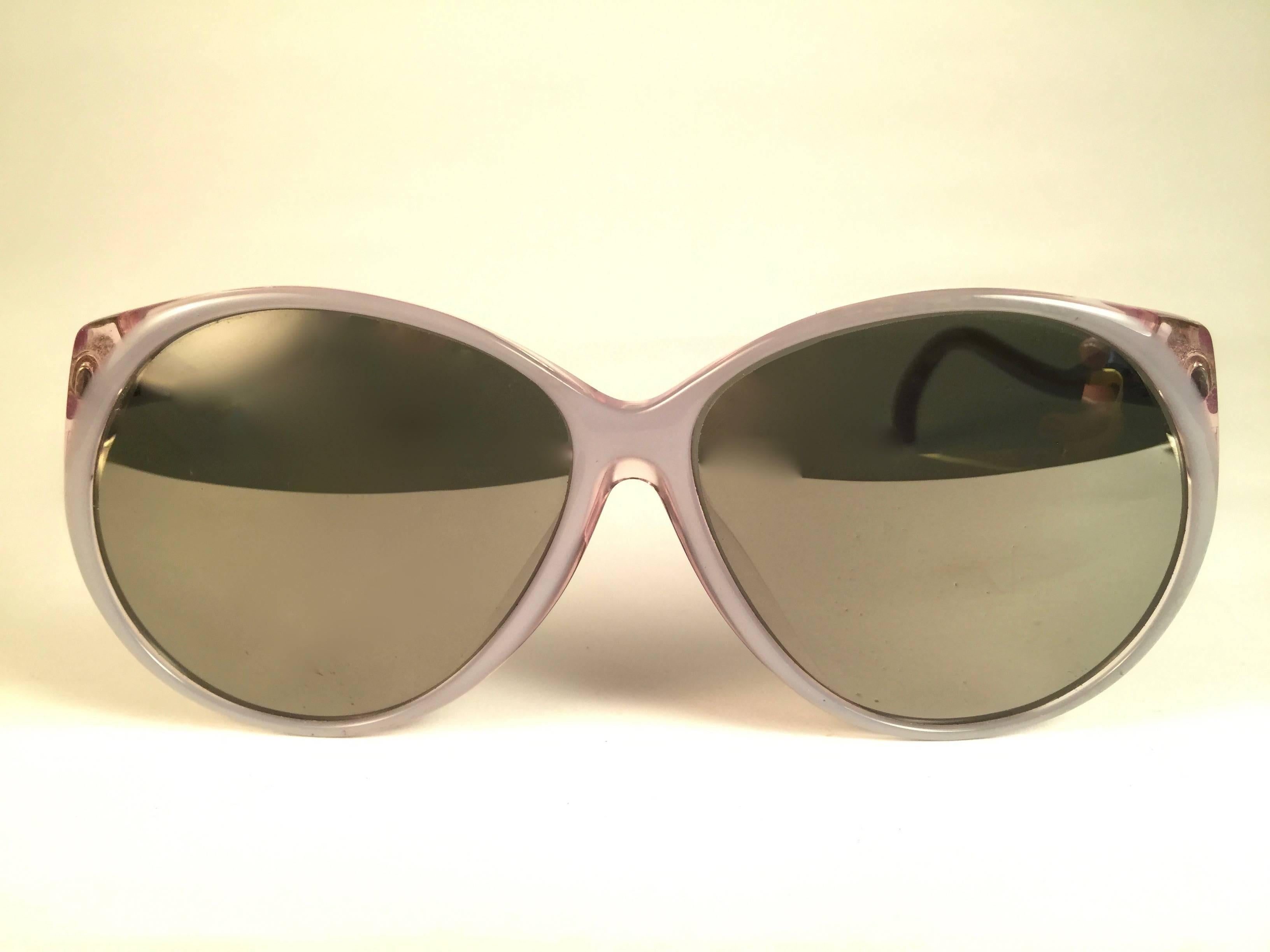 New and rare Vintage Christie frame holding a pair of mirror lenses.  
Never worn or displayed.  
This pair may have minor sign of wear due to nearly 40 years of storage. Designed and Produced in USA.