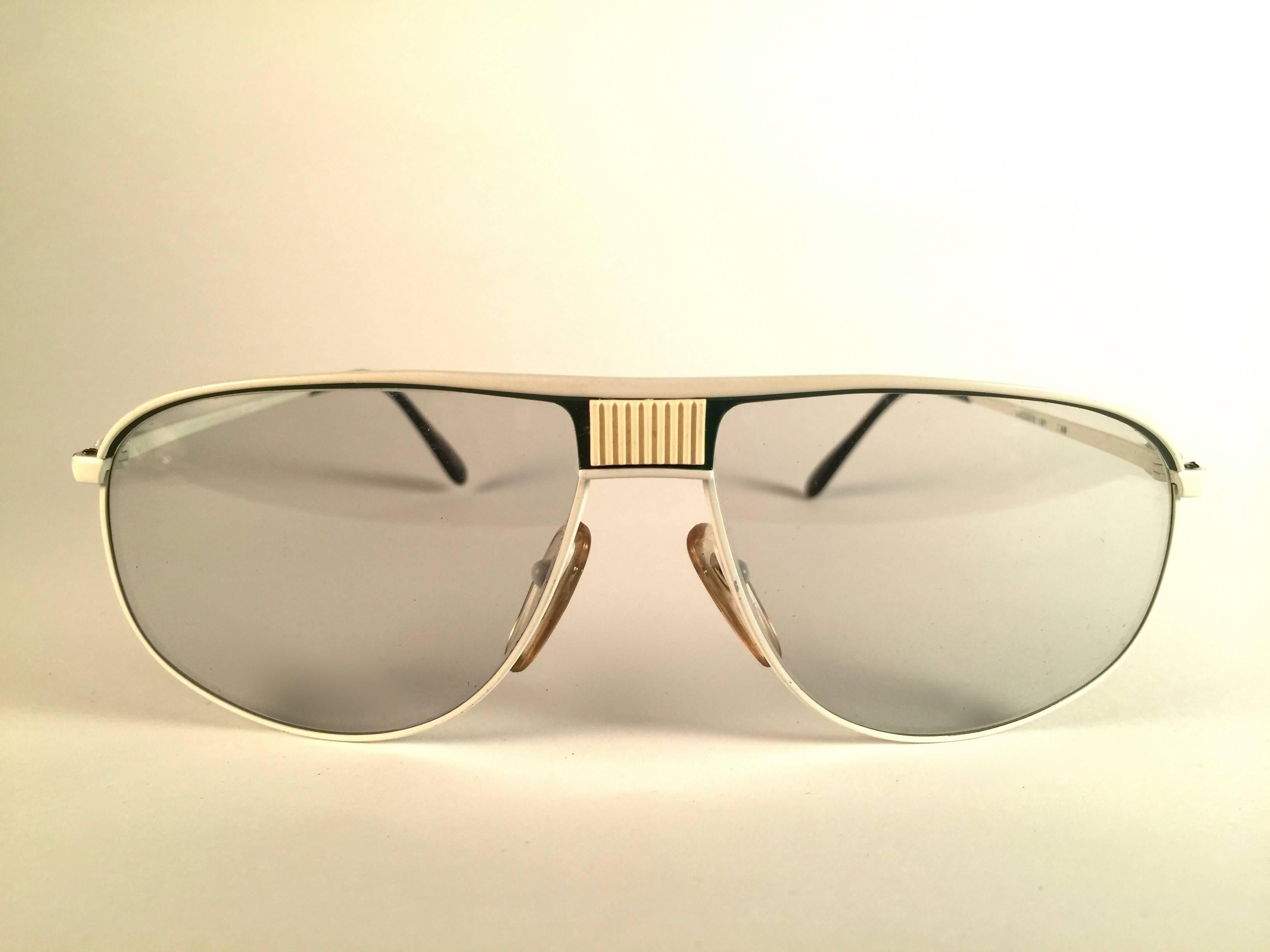 New Vintage Lacoste white with green accents frame holding a pair of light clear lenses. 
This pair may have minor sign of wear on the lens due to storage. 
New, never worn or displayed. 
Design and produced in France.