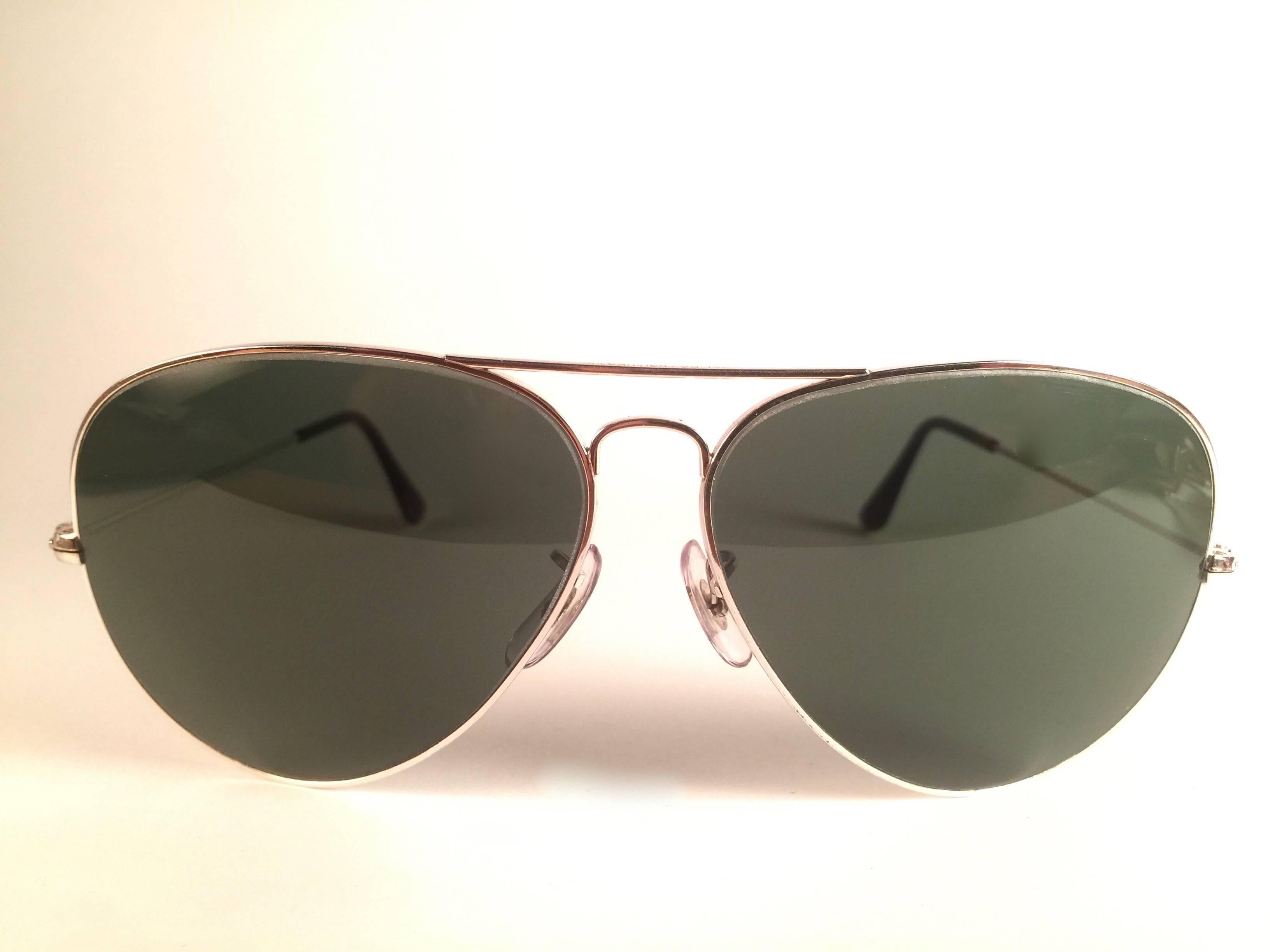New Super special vintage Ray Ban Aviator White Gold frame with B&L G15 Grey Lenses in SIZE 62!! 
Comes with its original Ray Ban B&L case. 
Rare and hard to find in this new, never worn or displayed condition.