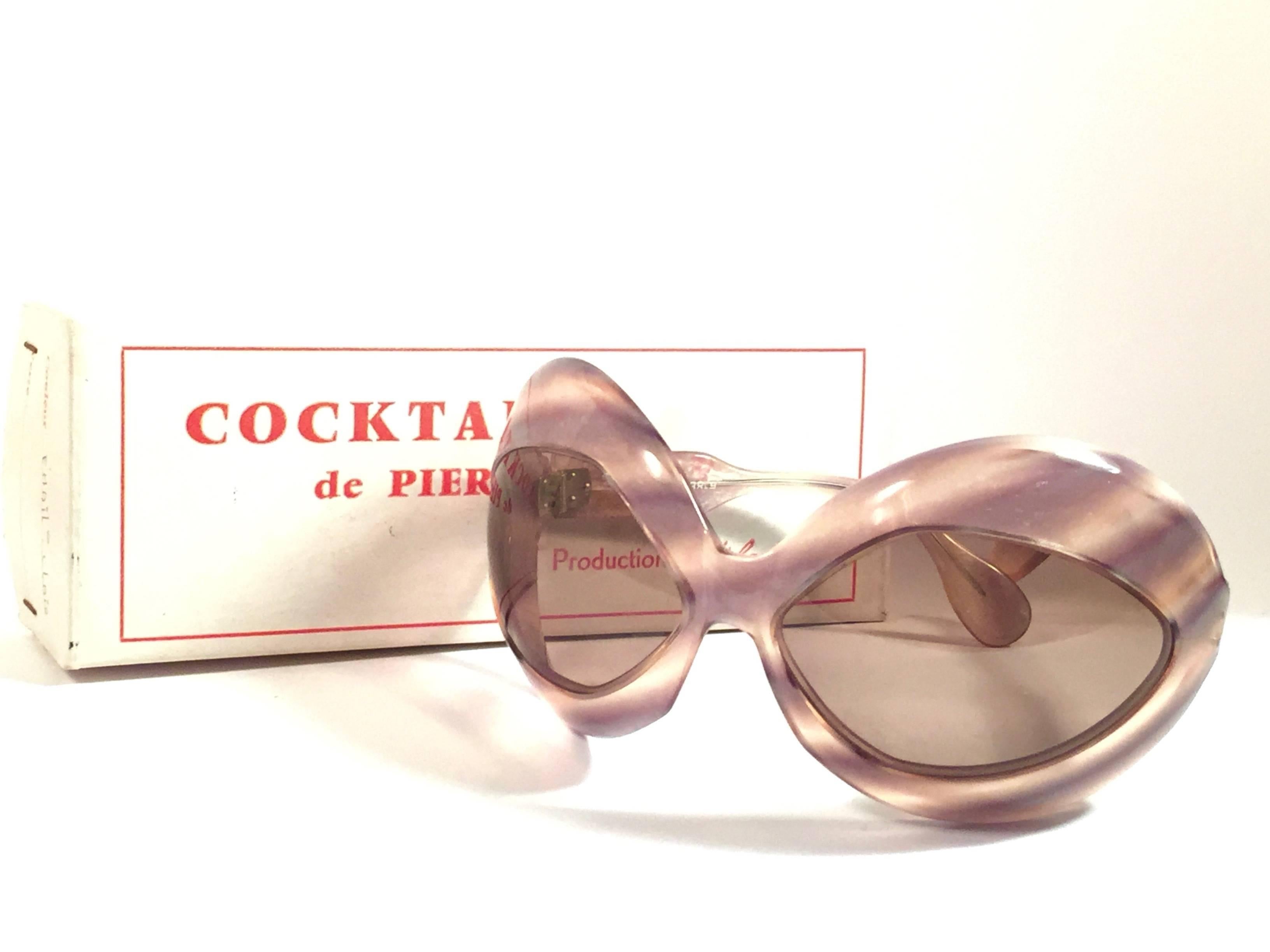 New Avant garde bug eyed frame " Pierre Marly “ Cocktail “ sunglasses.  Spotless light brown lenses. Amazing color straight from a super chic and crazy 1960’s Pierre Marly very own cocktail scene. The Very same model worn by Jackie Kennedy. 