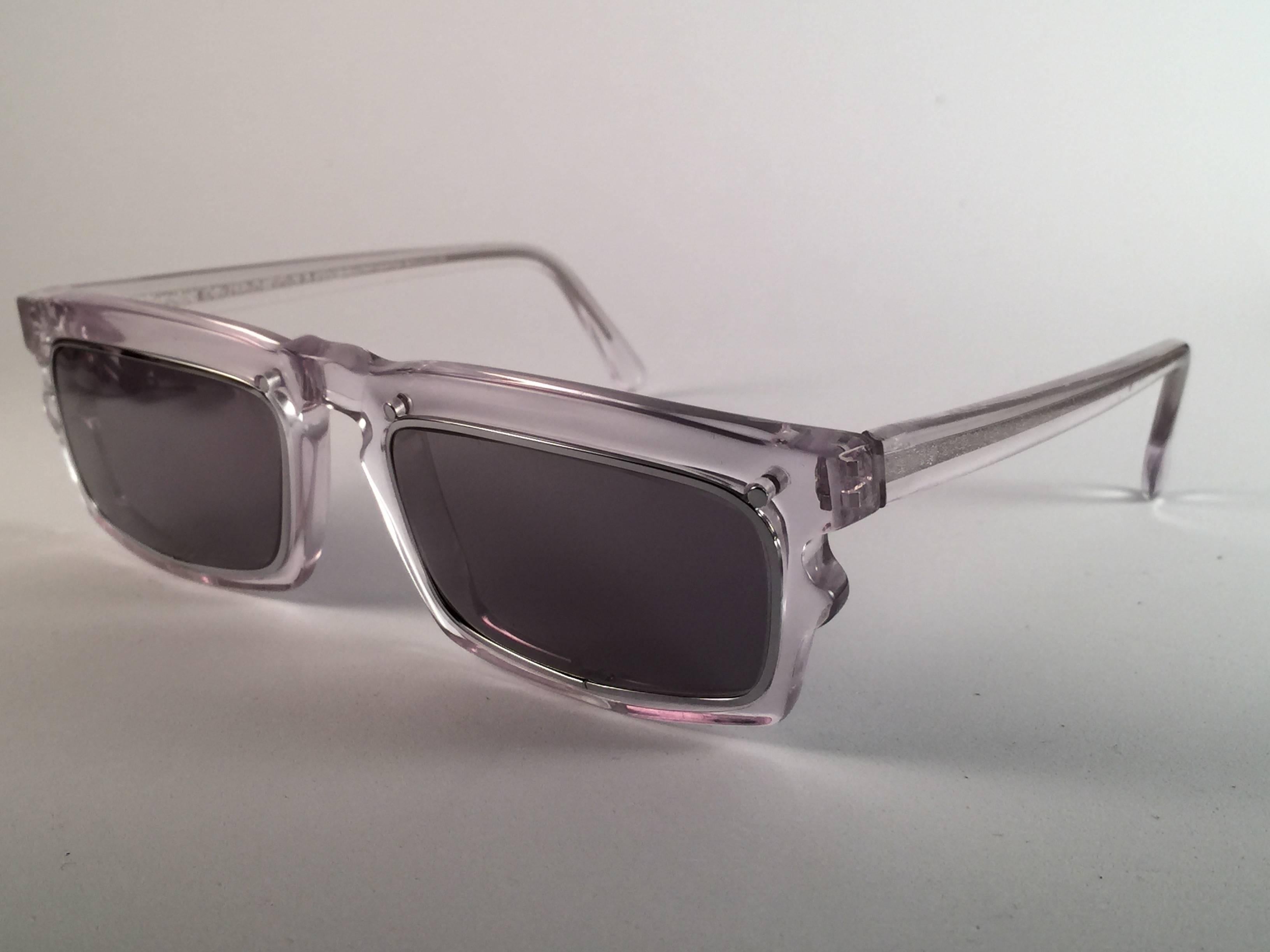 New vintage IDC 767, rectangular clear frame holding pair of spotless mirror lenses.  The very same model worn by Anthony Kiedis from Red Hot Chili Peppers. New, never worn or displayed this pair may have minor sign of wear due to storage. Made in